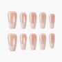 Set of glossy nude pink handmade press-on nails arranged on a white background.