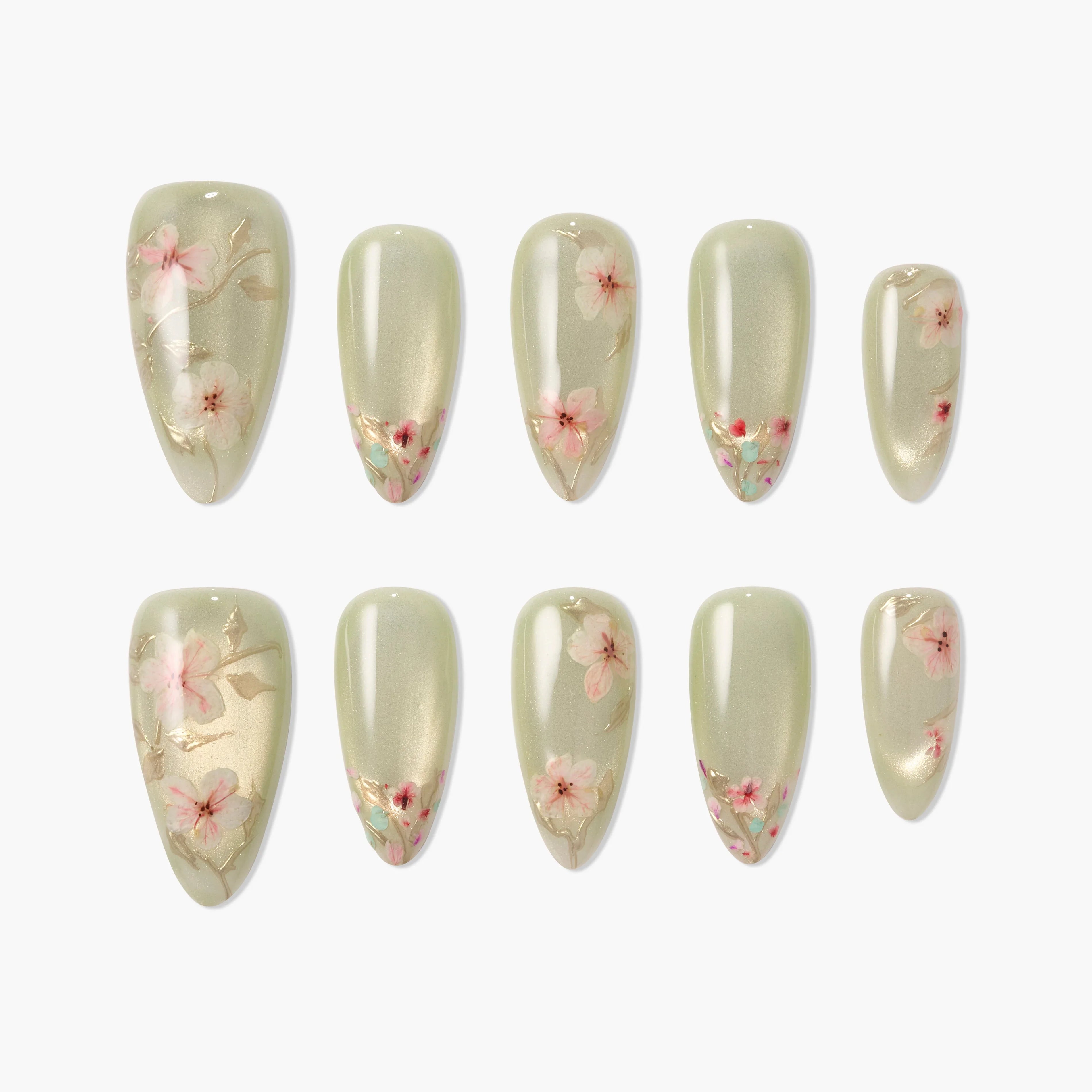 Handmade press-on nails with pale green base and delicate pink floral design, glossy finish