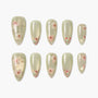 Handmade press-on nails with pale green base and delicate pink floral design, glossy finish
