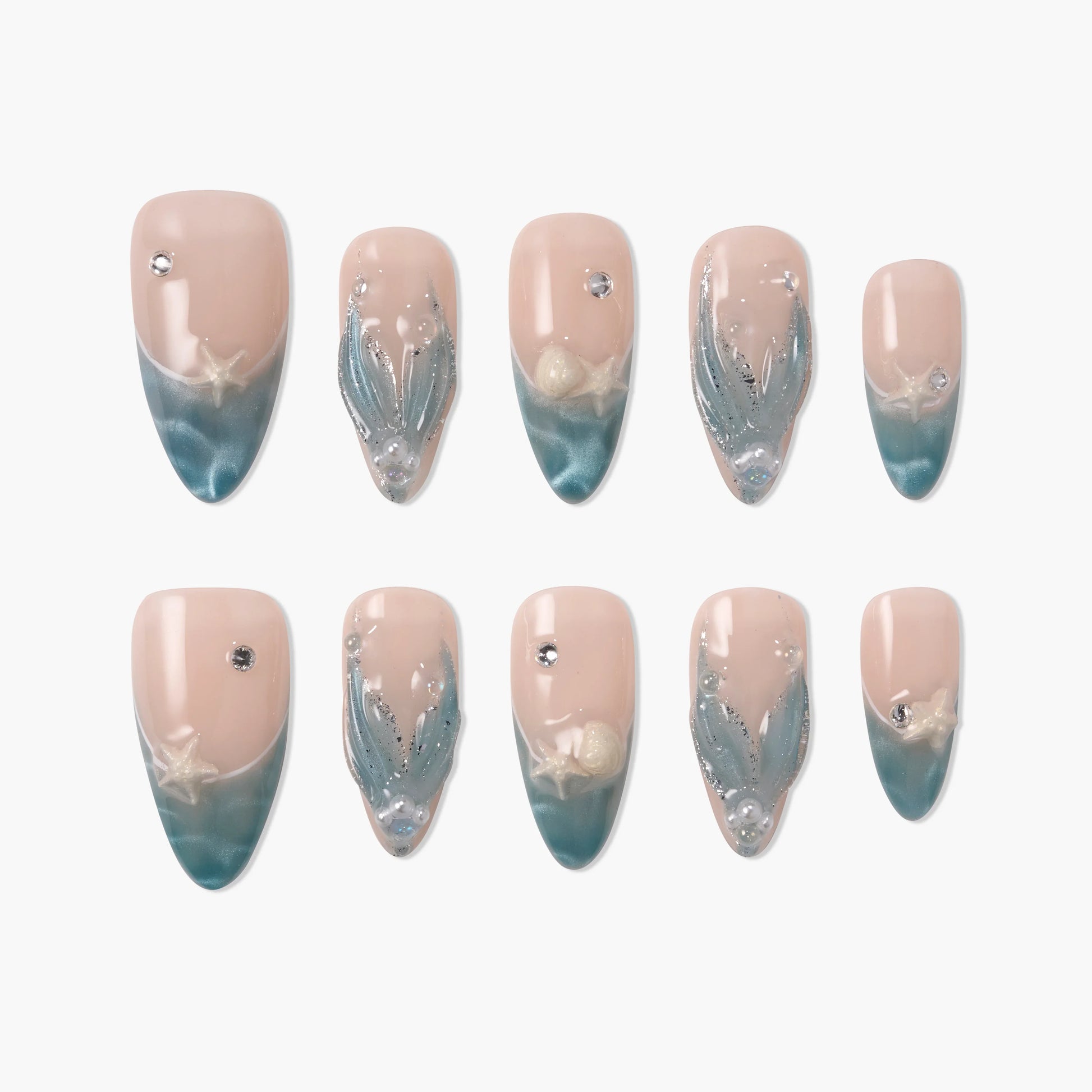 Blue and nude press-on nails with seashell and pearl accents, ocean-inspired nail design
