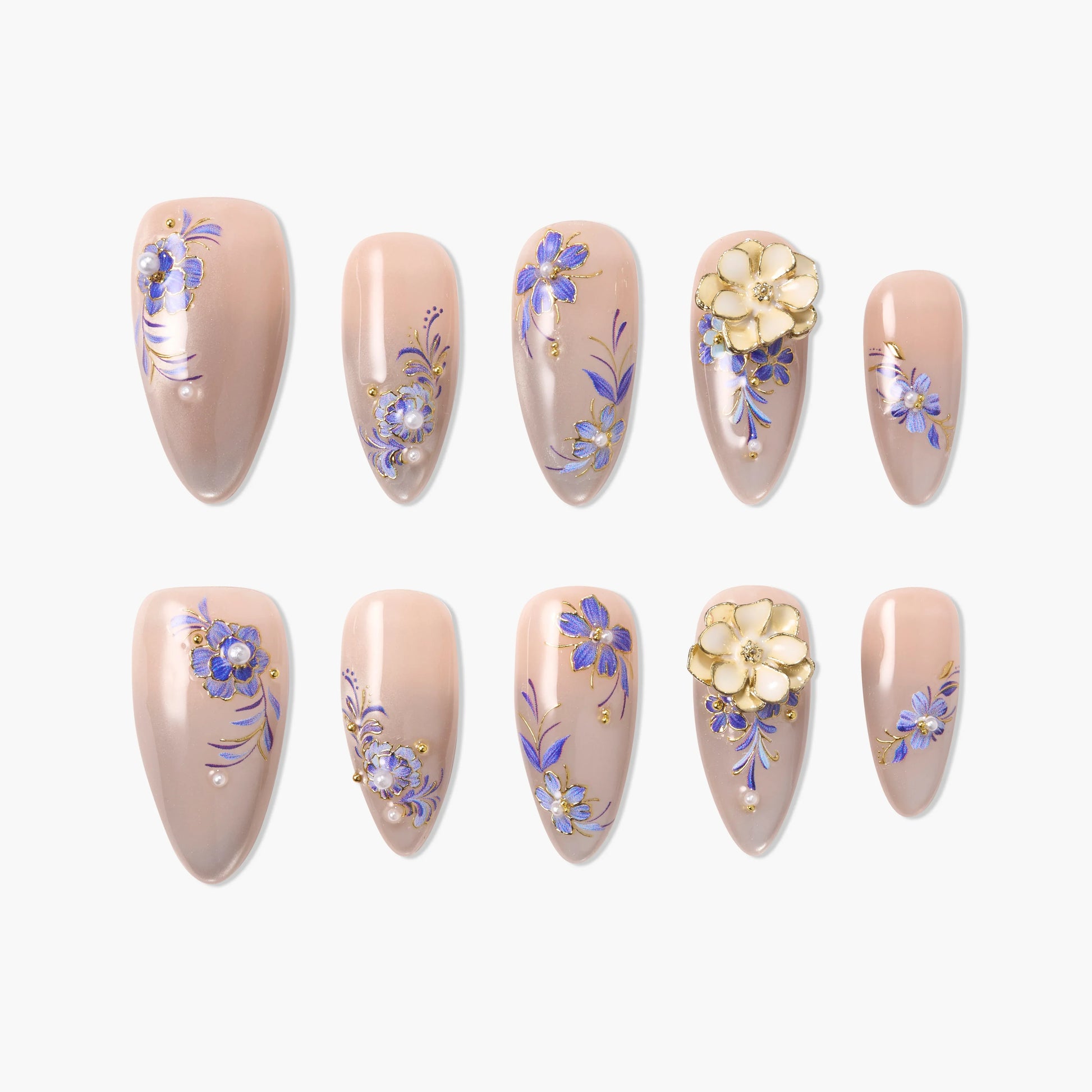 Handmade press-on nails with nude base, purple and gold floral designs, 3D flower accents