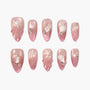 Pink seashell-themed press-on nails with pearl and starfish 3D accents, arranged on white background.