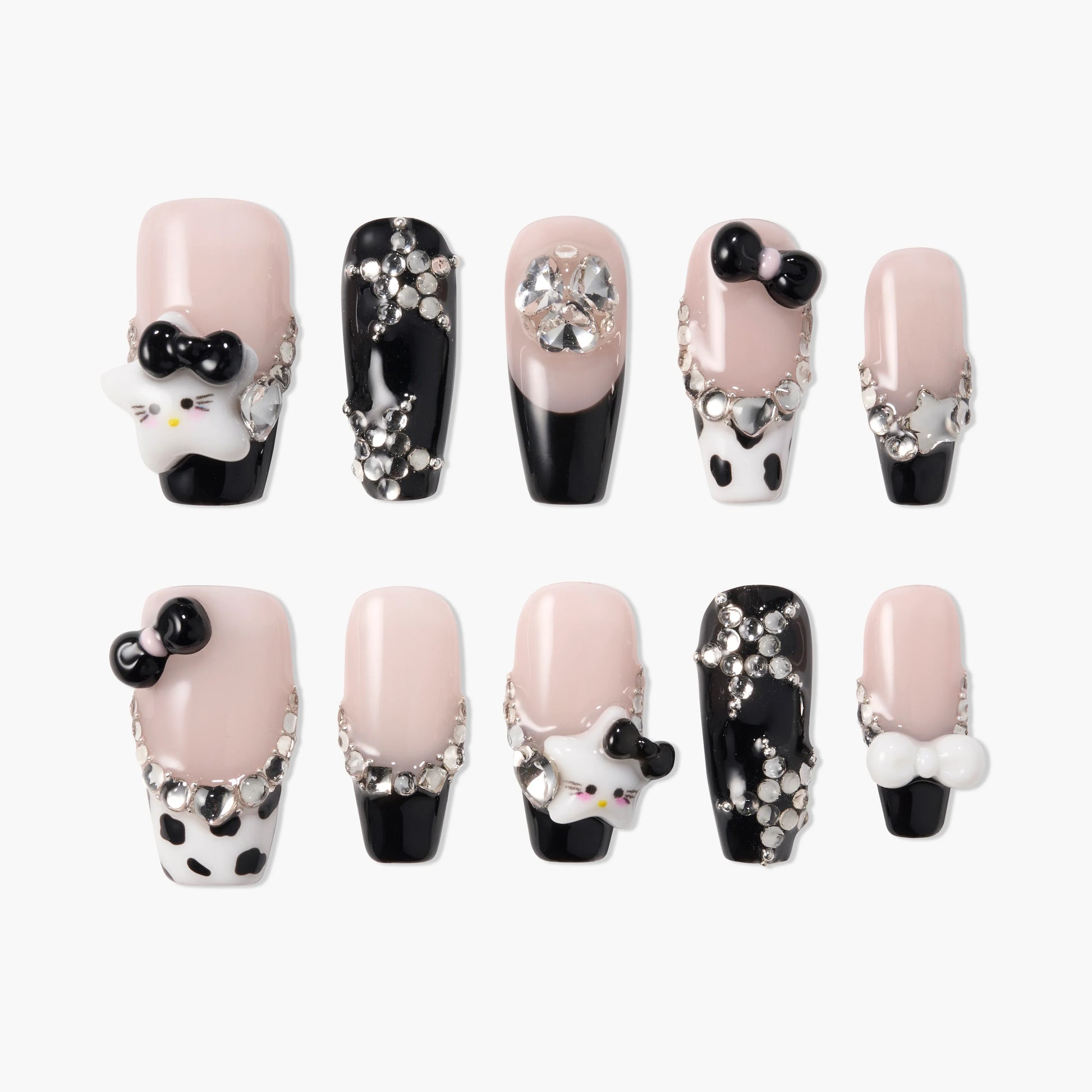 Handmade press-on nails with pink and black designs, rhinestones, 3D bows, and star charms.