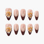 Glitter nude and brown French press-on nails with 3D yellow floral accents and rhinestones