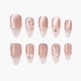 Handmade press-on nails in blush pink with crystal accents and 3D floral designs