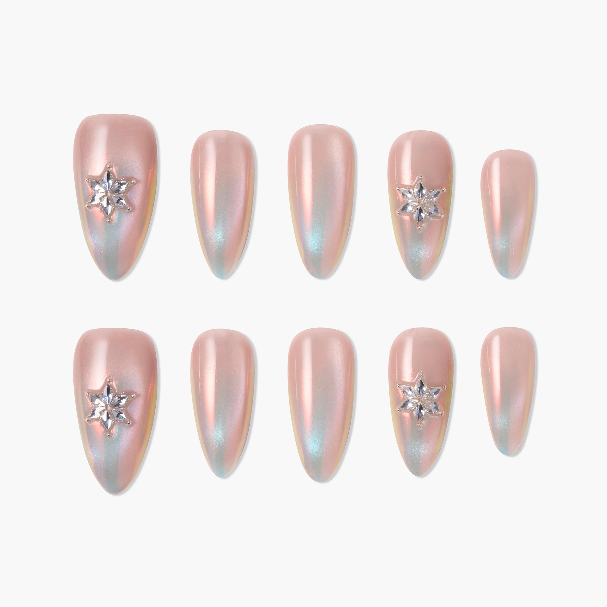 Iridescent pink almond press-on nails with star rhinestone accents, set on a white background