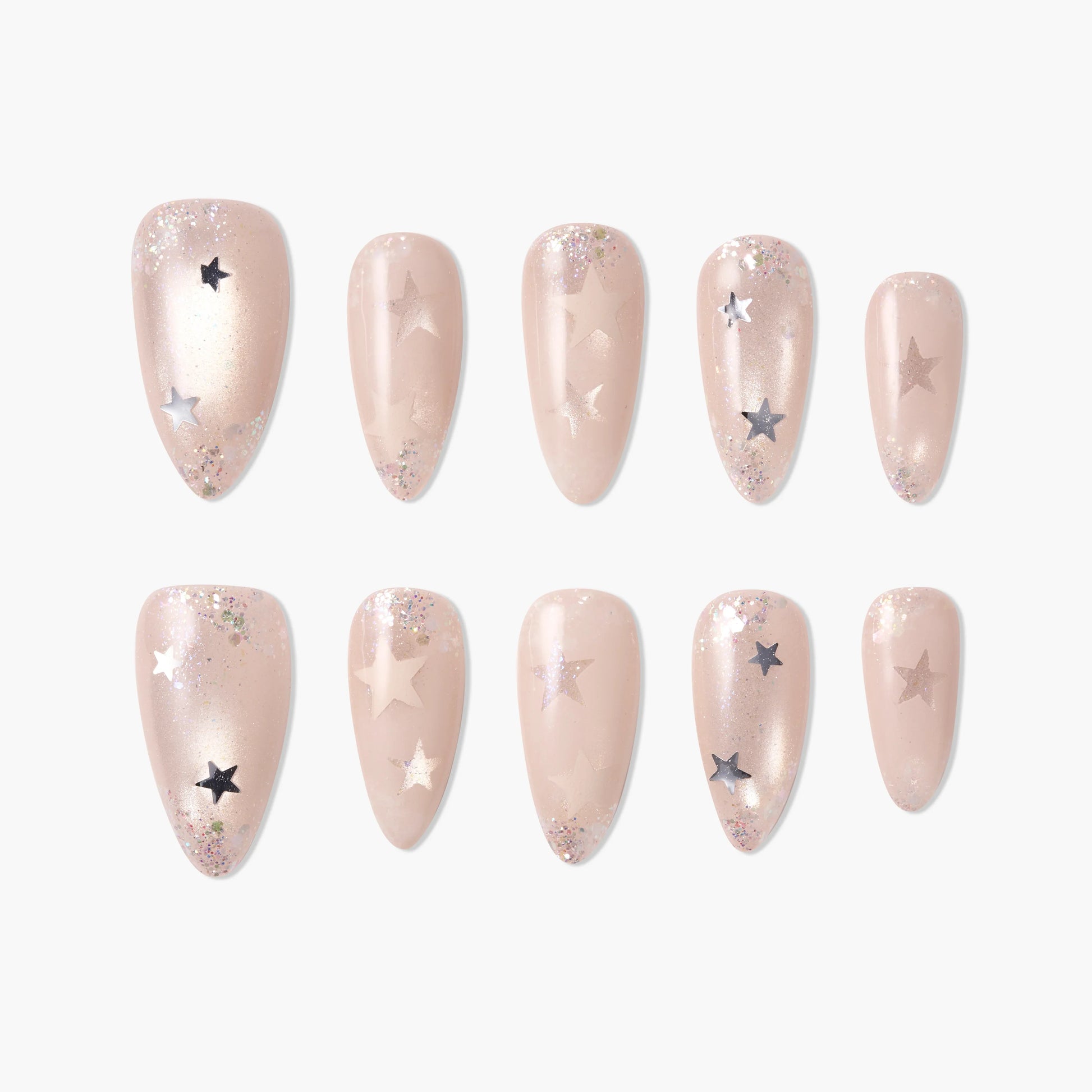 Nude press-on nails with silver glitter and star accents, arranged on white background