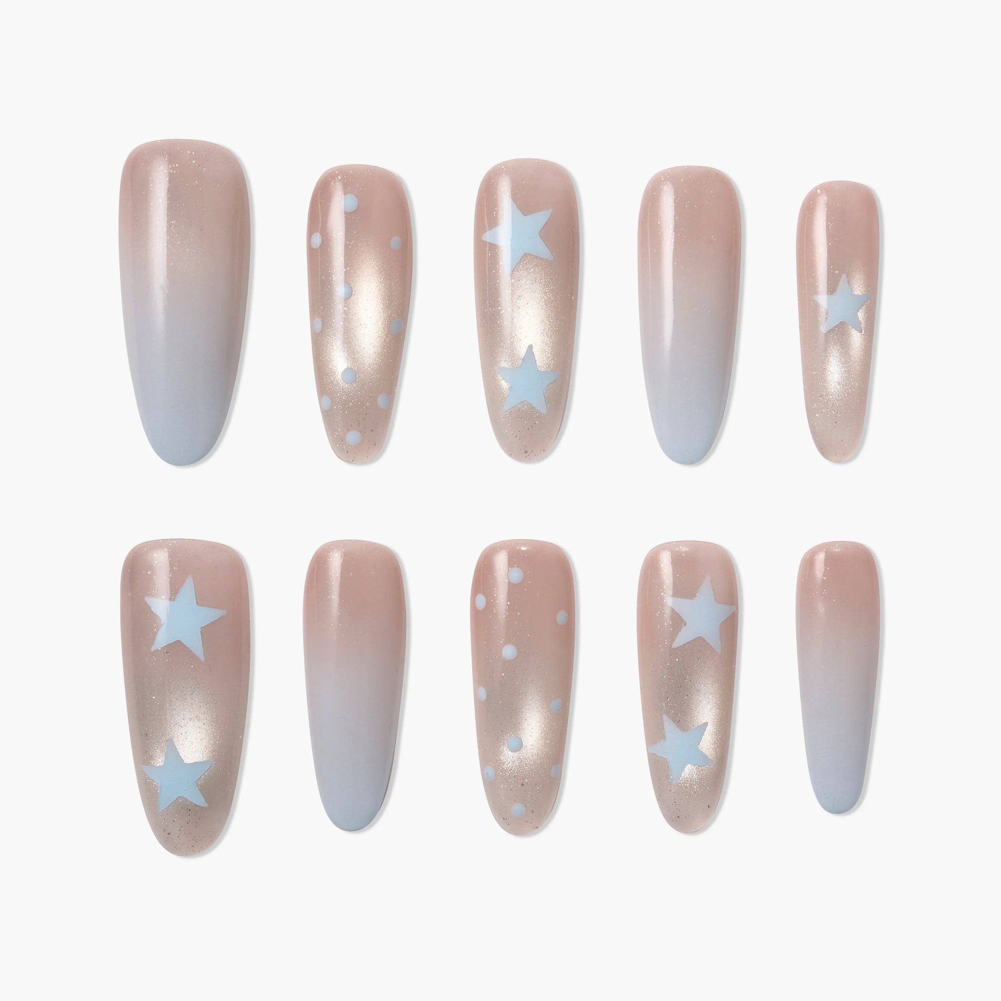 Handmade press-on nails with nude to blue ombré, blue stars and polka dot designs