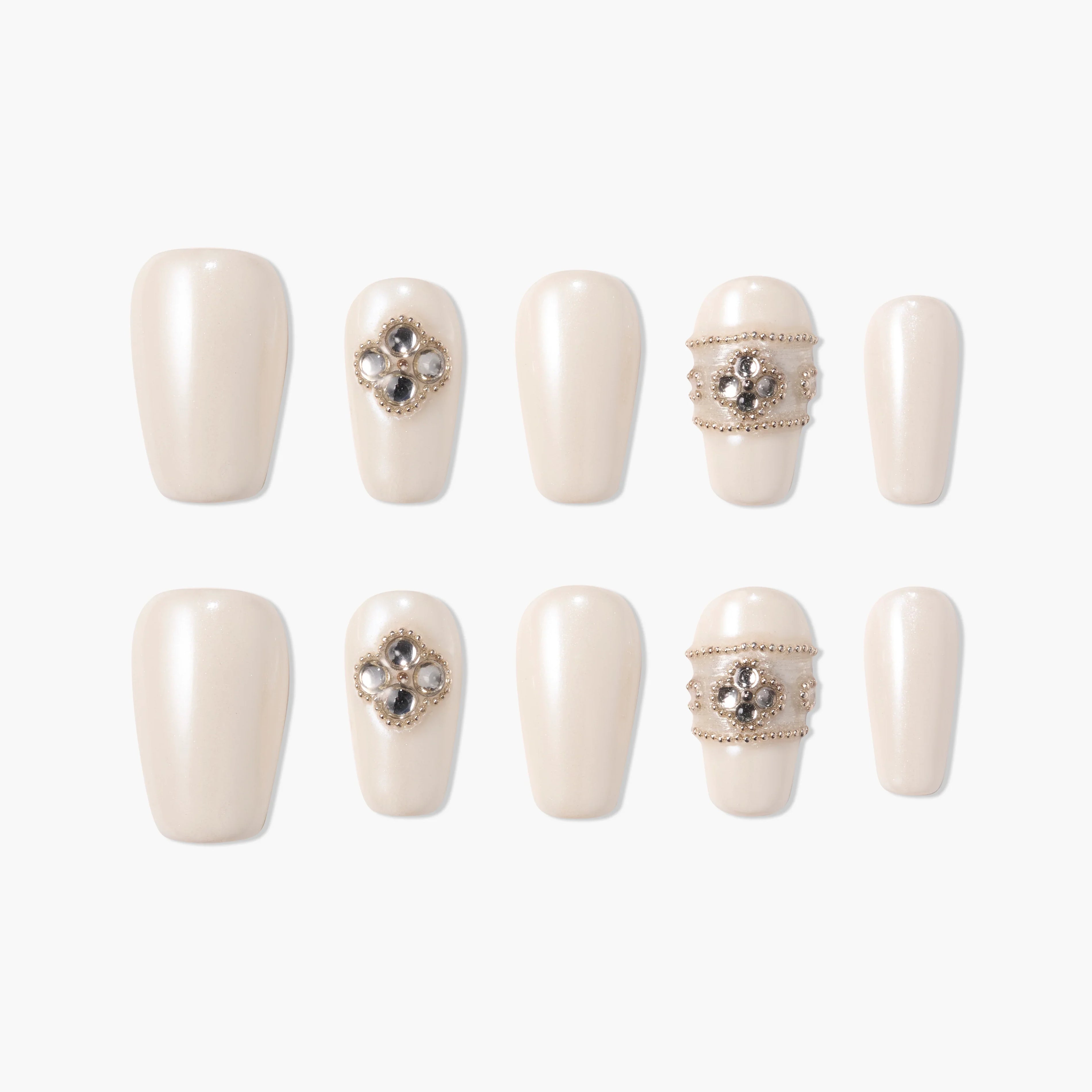 Pearl white press-on nails with 3D jeweled floral and beaded accents, arranged on white background.