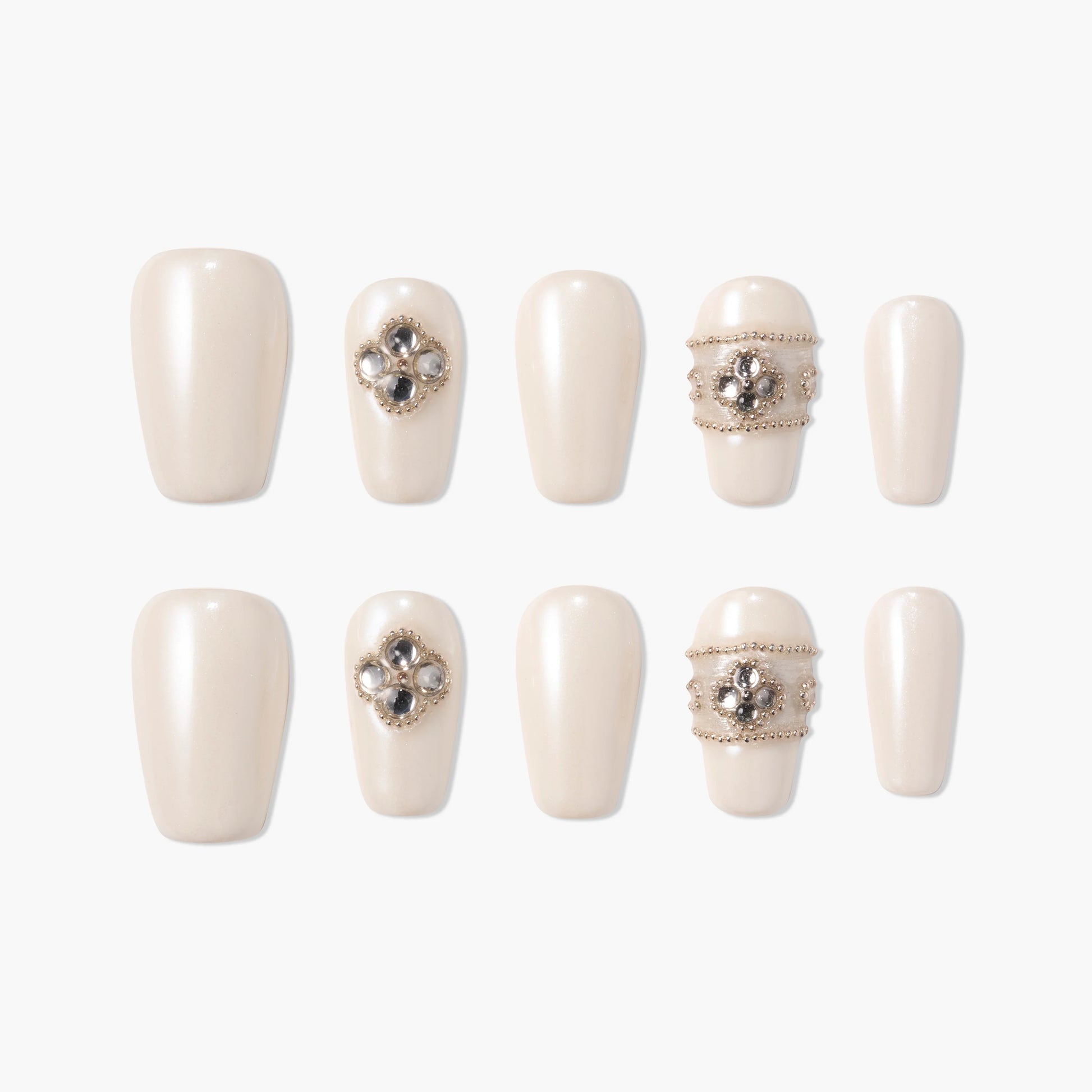 Pearl white press-on nails with 3D jeweled floral and beaded accents, arranged on white background.
