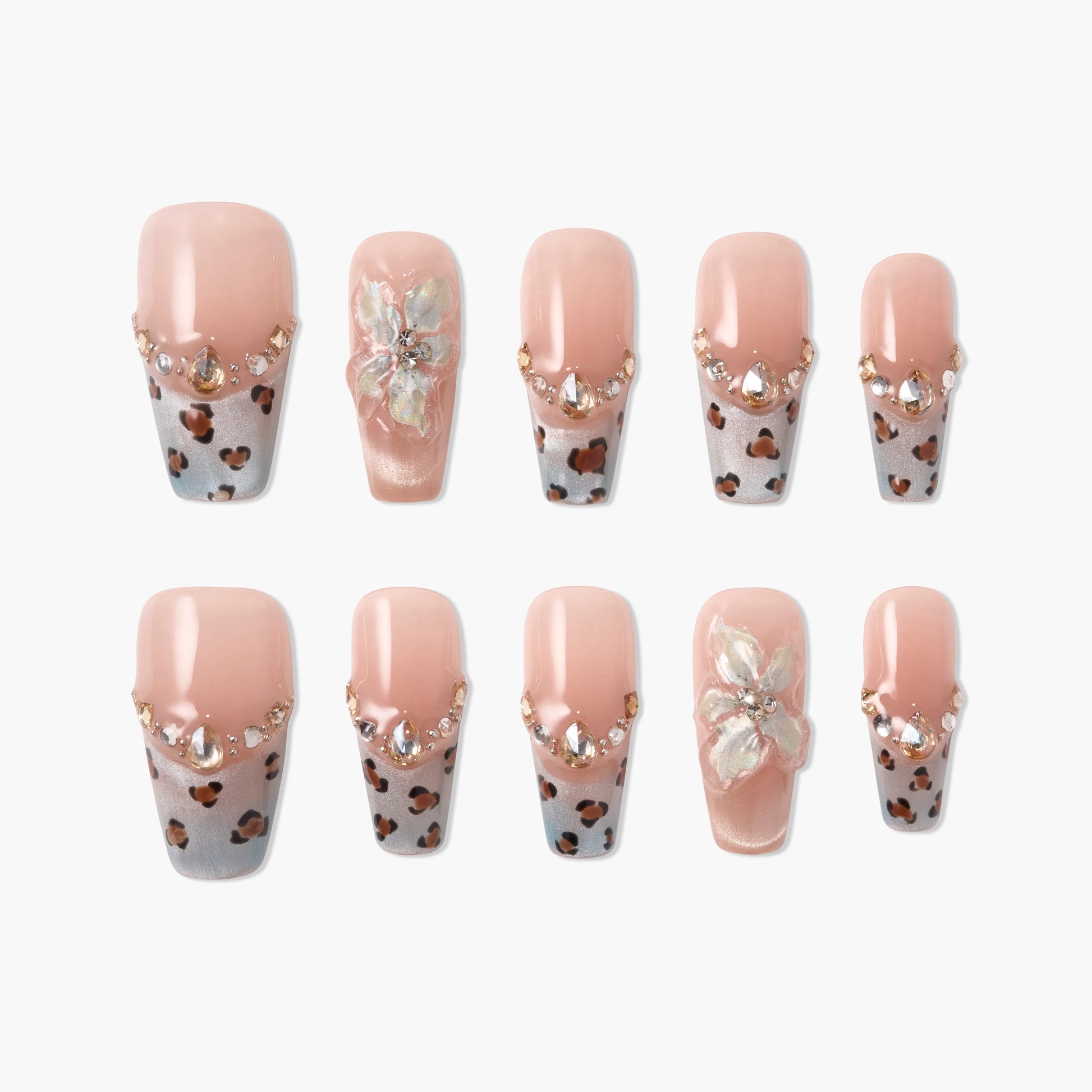 Handmade press-on nails with pink base, leopard print tips, rhinestones, and 3D floral accents