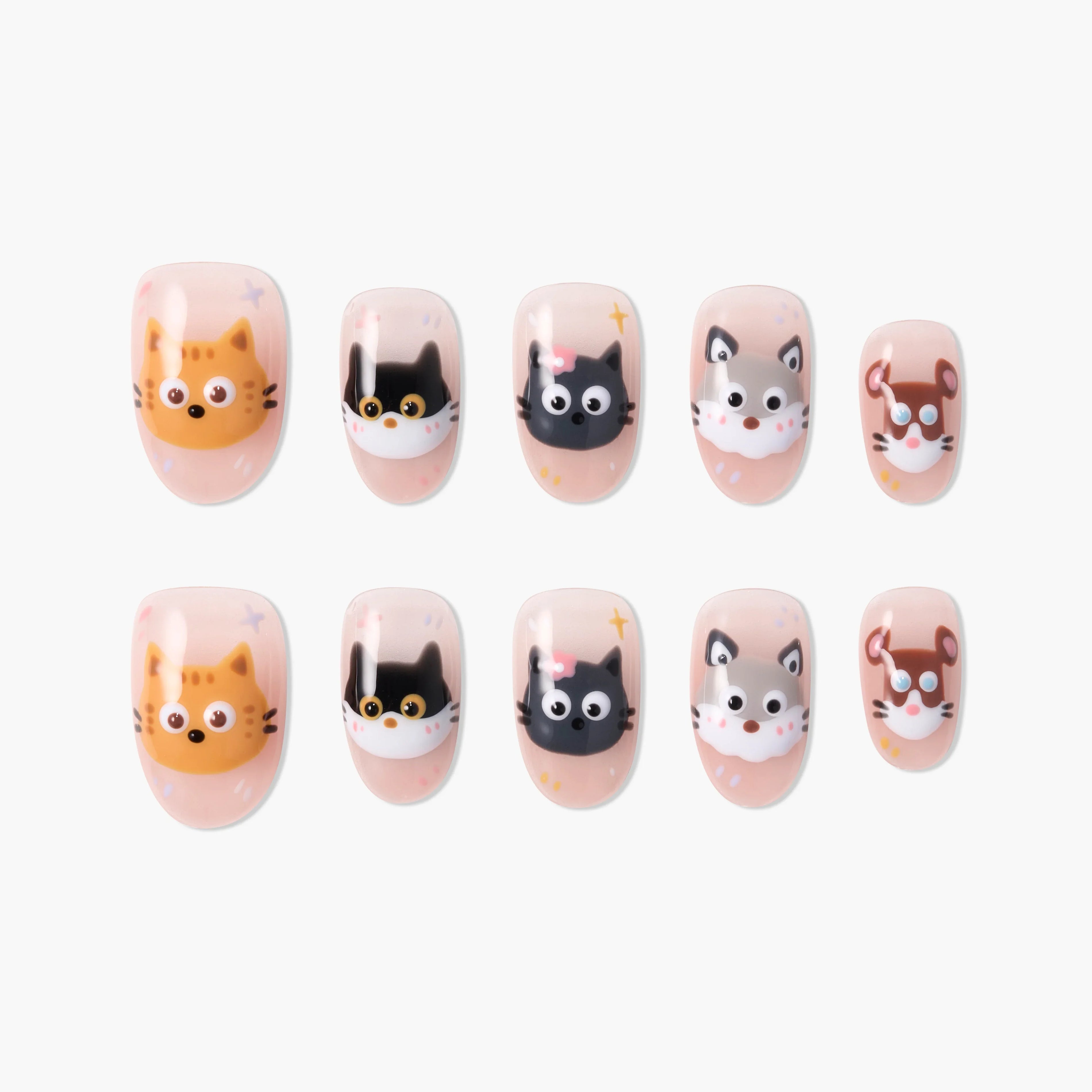 Handmade press-on nails with cute cat, dog, and mouse cartoon faces on a nude background