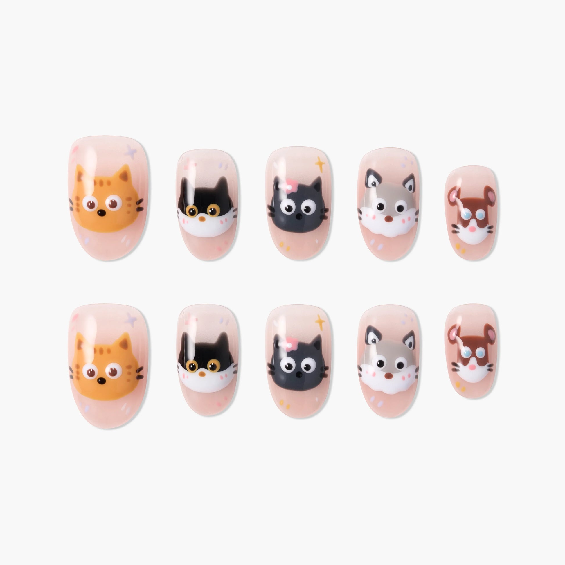 Handmade press-on nails with cute cat, dog, and mouse cartoon faces on a nude background