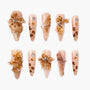 Handmade press-on nails with 3D brown floral designs, gold accents, and rhinestones
