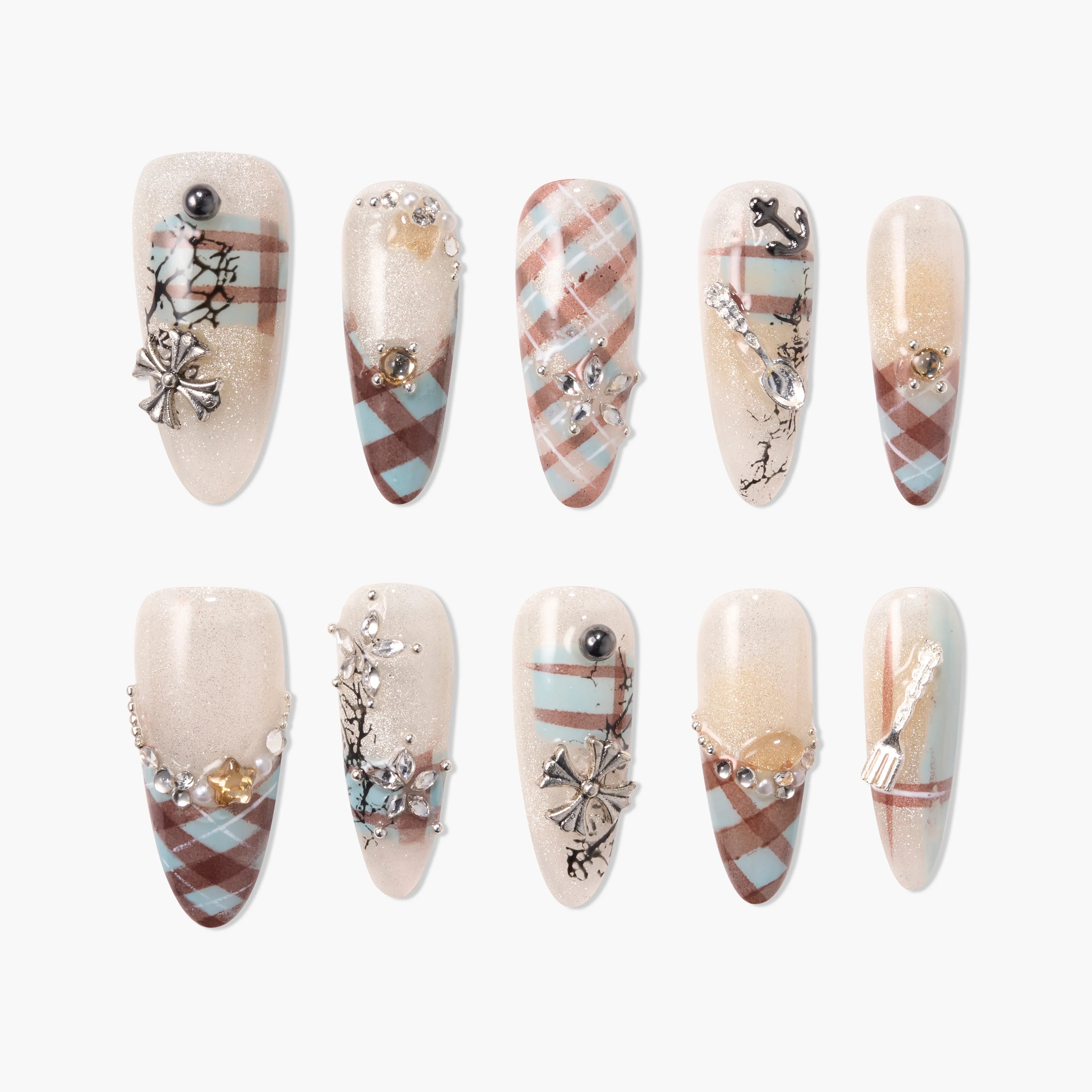 Handmade press-on nails with beige shimmer, blue and brown plaid, rhinestones, and 3D floral charms.