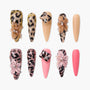 Handmade press-on nails with leopard print, 3D floral designs, and rhinestone accents
