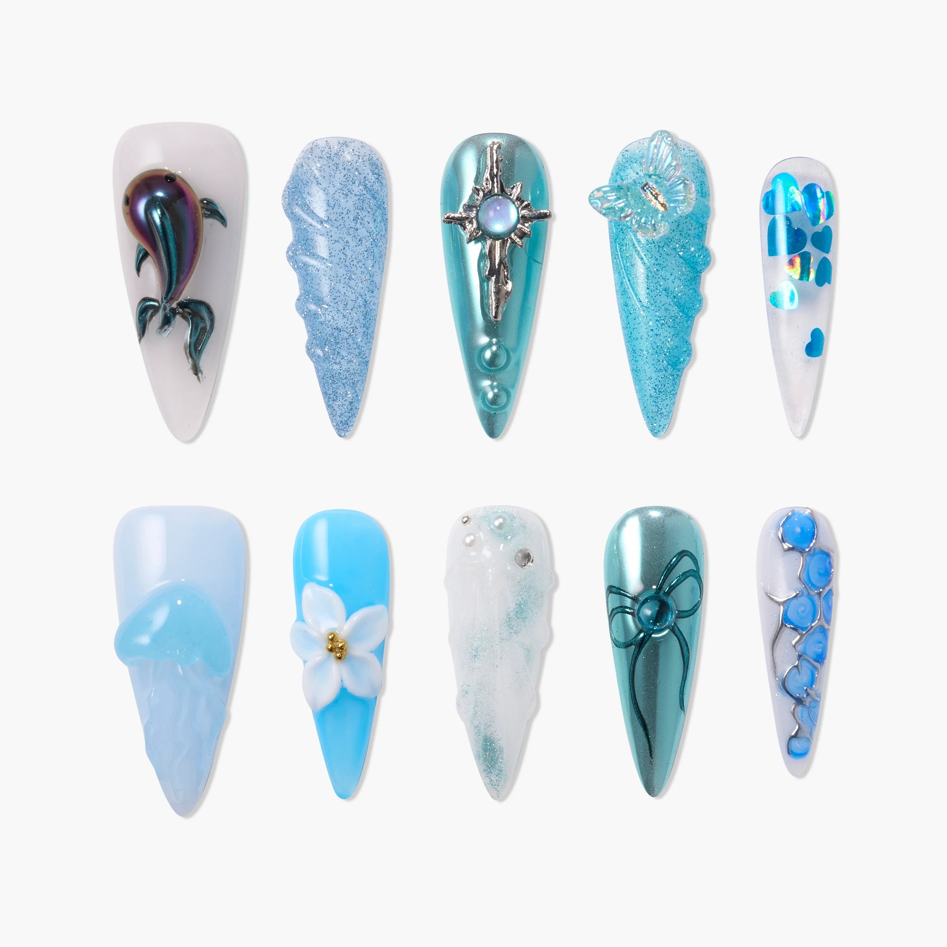 Handmade press-on nails with blue, teal, and white ocean-inspired 3D designs and embellishments