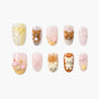 Handmade press-on nails with kawaii 3D bear, bow, and star designs in pastel colors