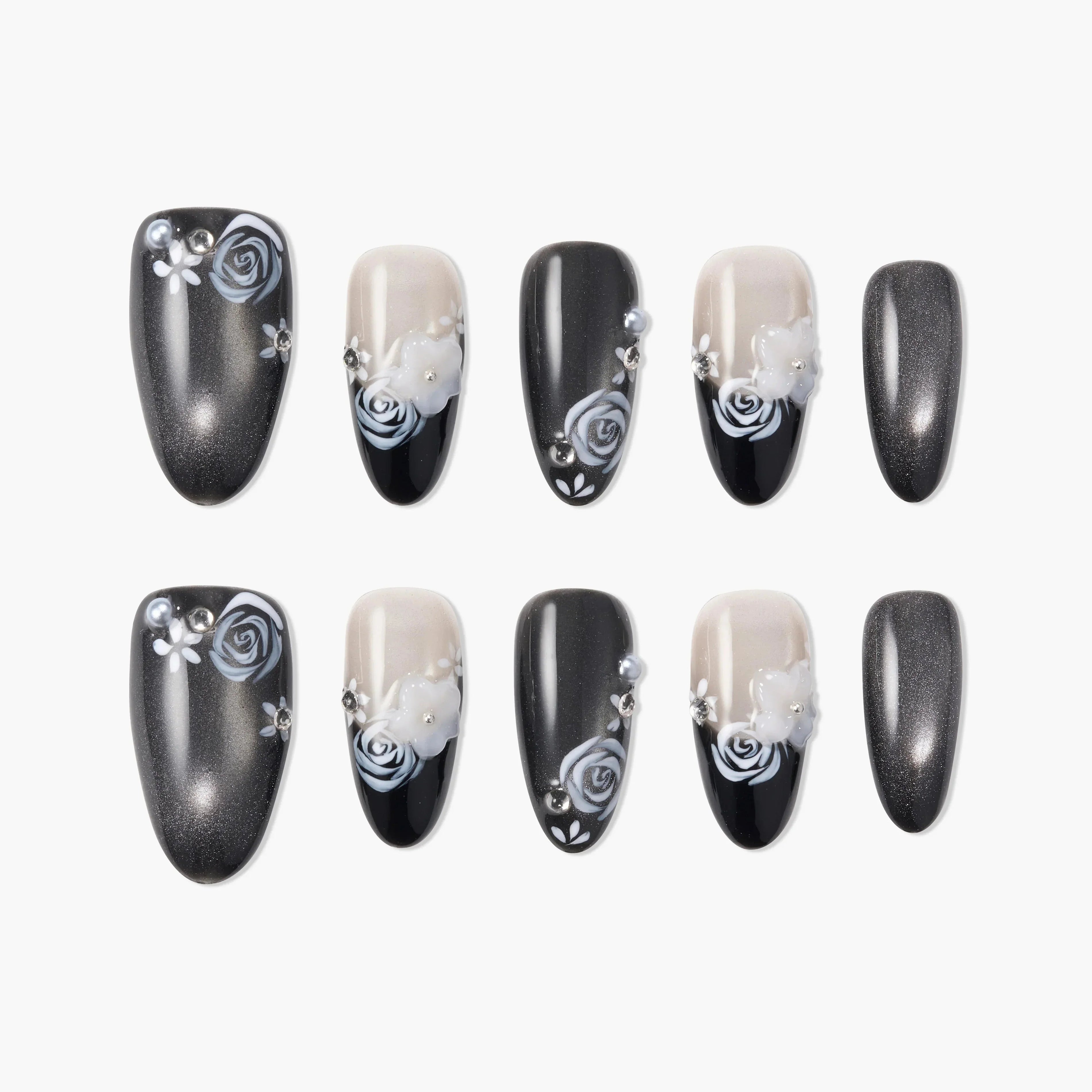 Handmade press-on nails with black, silver, and nude tones, featuring 3D floral and rose designs with rhinestones.
