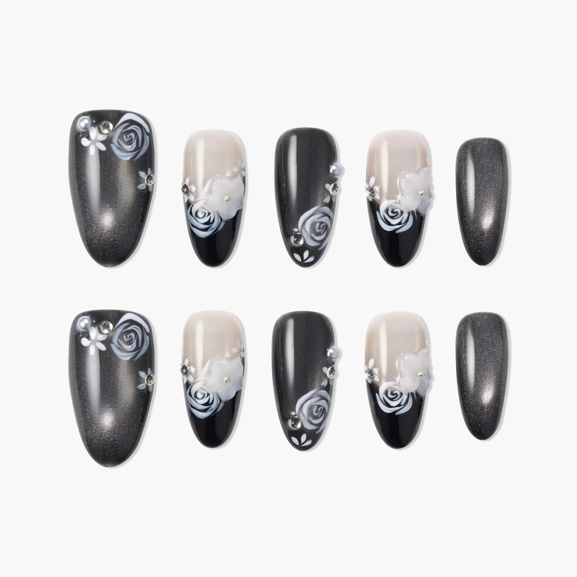 Handmade press-on nails with black, silver, and nude tones, featuring 3D floral and rose designs with rhinestones.