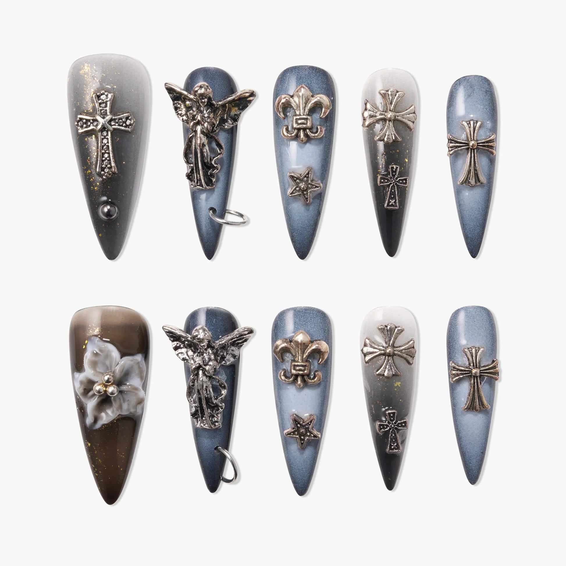 Handmade press-on nails in blue and gray ombre with 3D metallic cross, angel, and fleur-de-lis charms