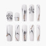 White press-on nails with silver metallic accents, 3D flower and bead details, elegant design