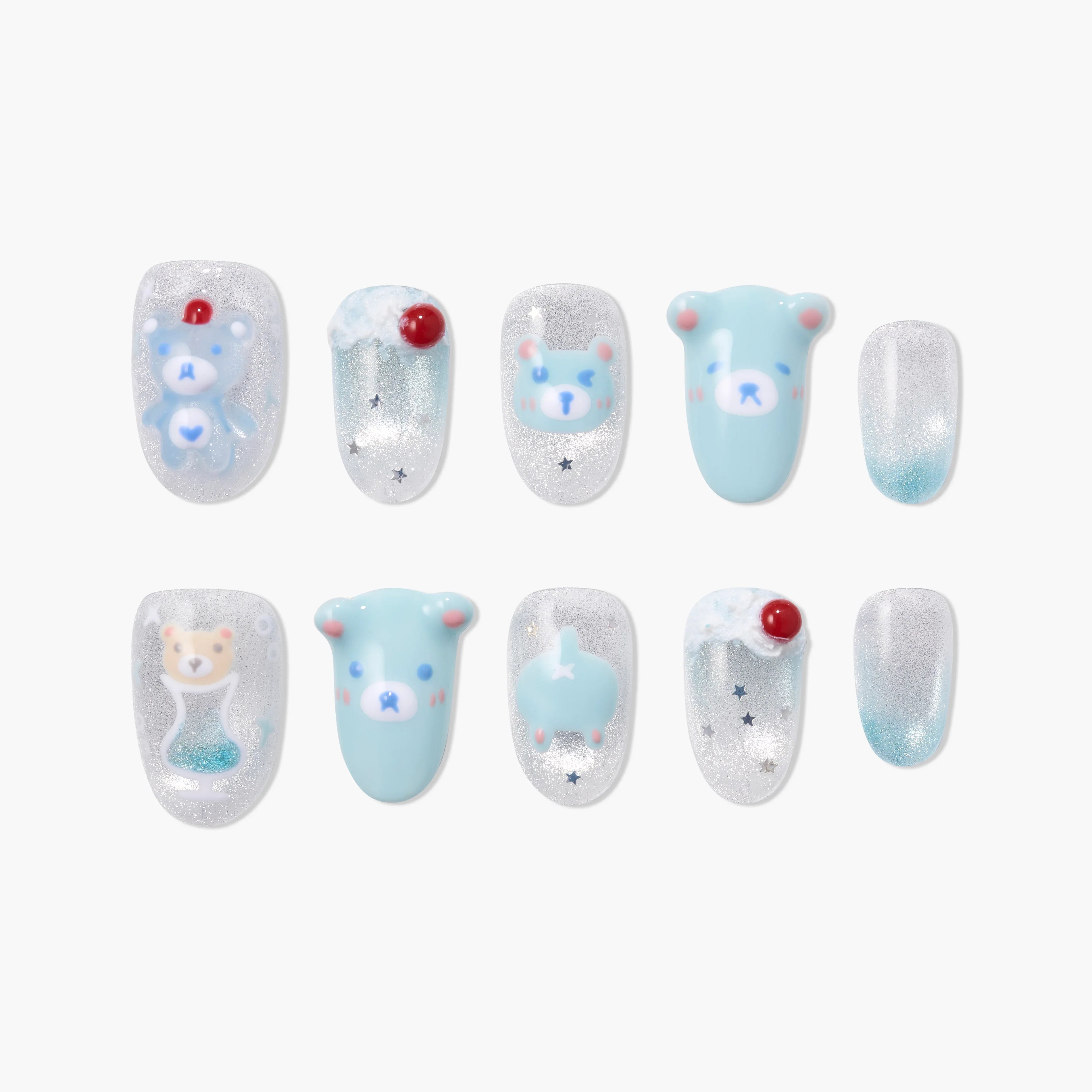 Handmade press-on nails with blue and silver bear and cherry designs, glitter accents