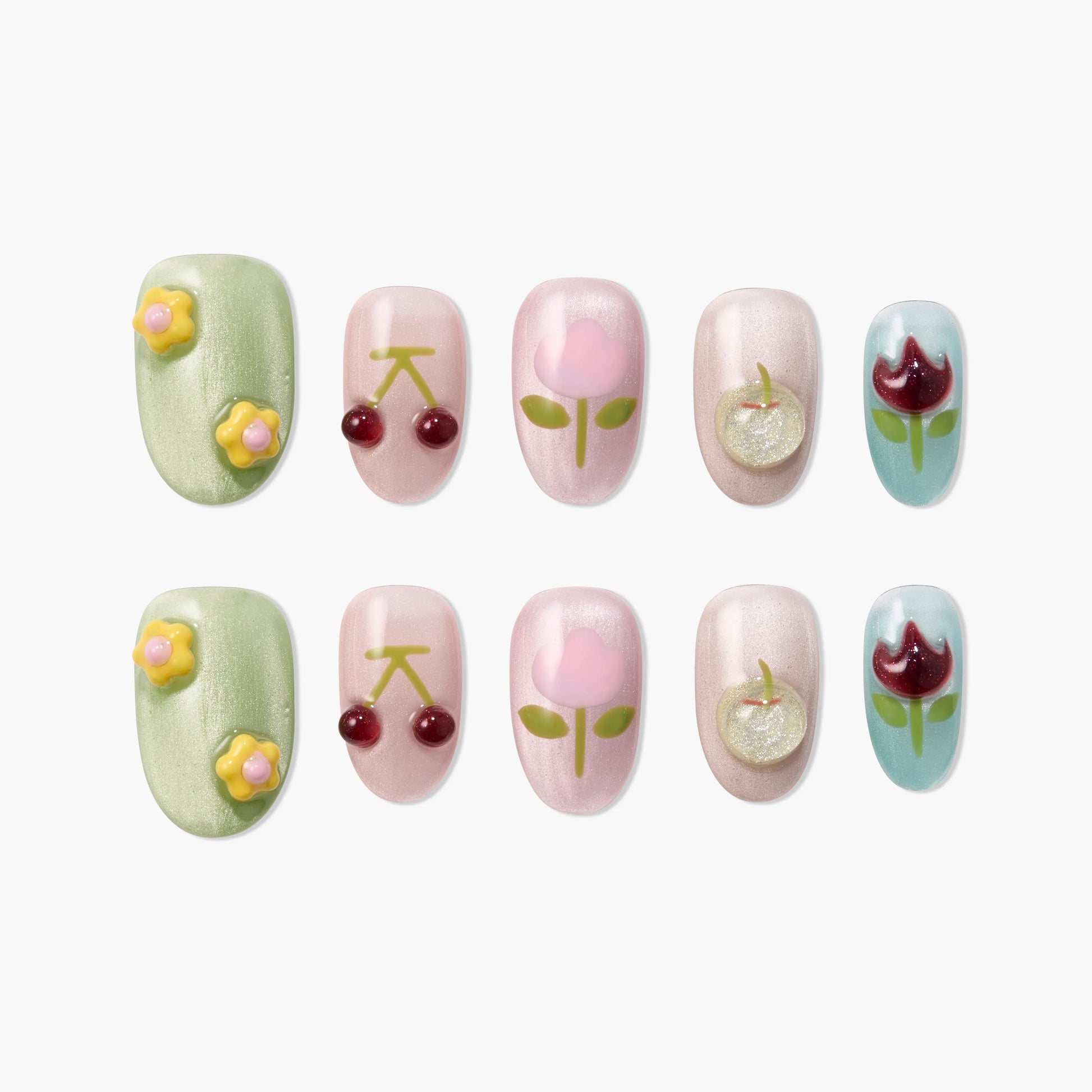 Handmade press-on nails with floral and cherry designs in pastel colors, set on white background