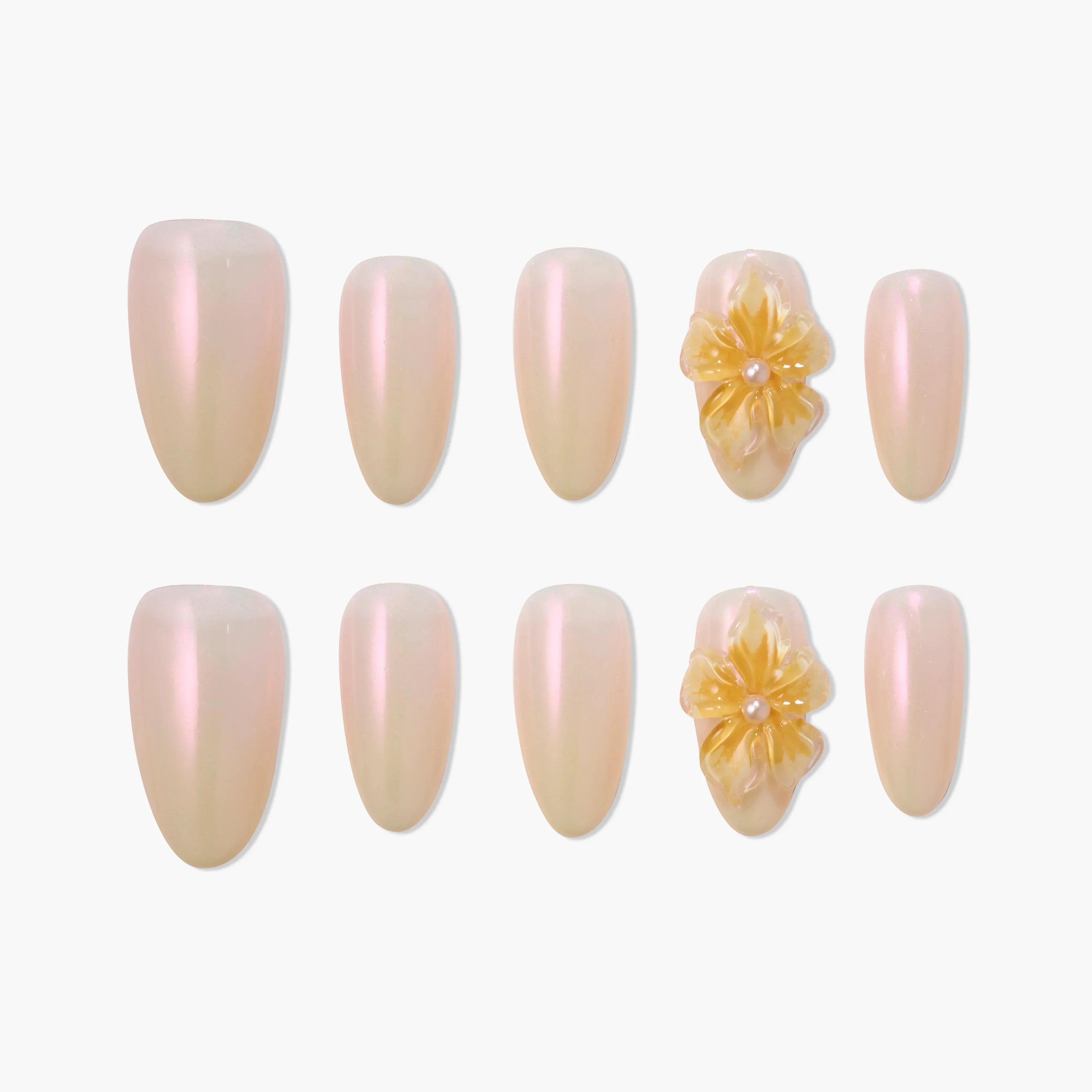 Iridescent nude press-on nails set with 3D yellow floral accents and pearl detail