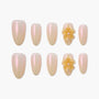 Iridescent nude press-on nails set with 3D yellow floral accents and pearl detail