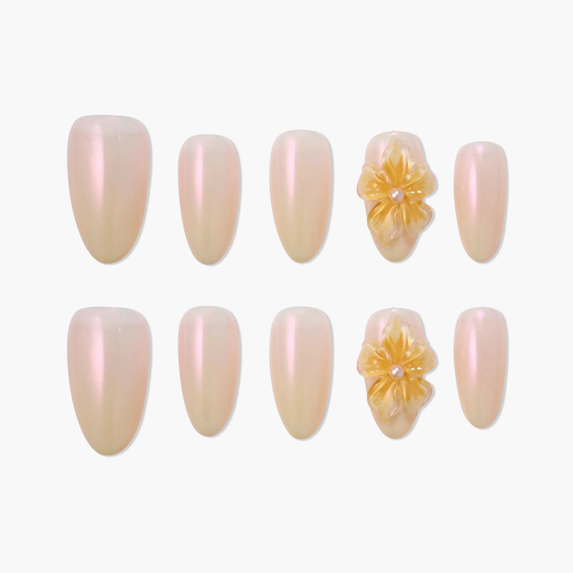 Iridescent nude press-on nails set with 3D yellow floral accents and pearl detail