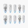 Silver and blue ombre press-on nails with crystal cross and rhinestone accents