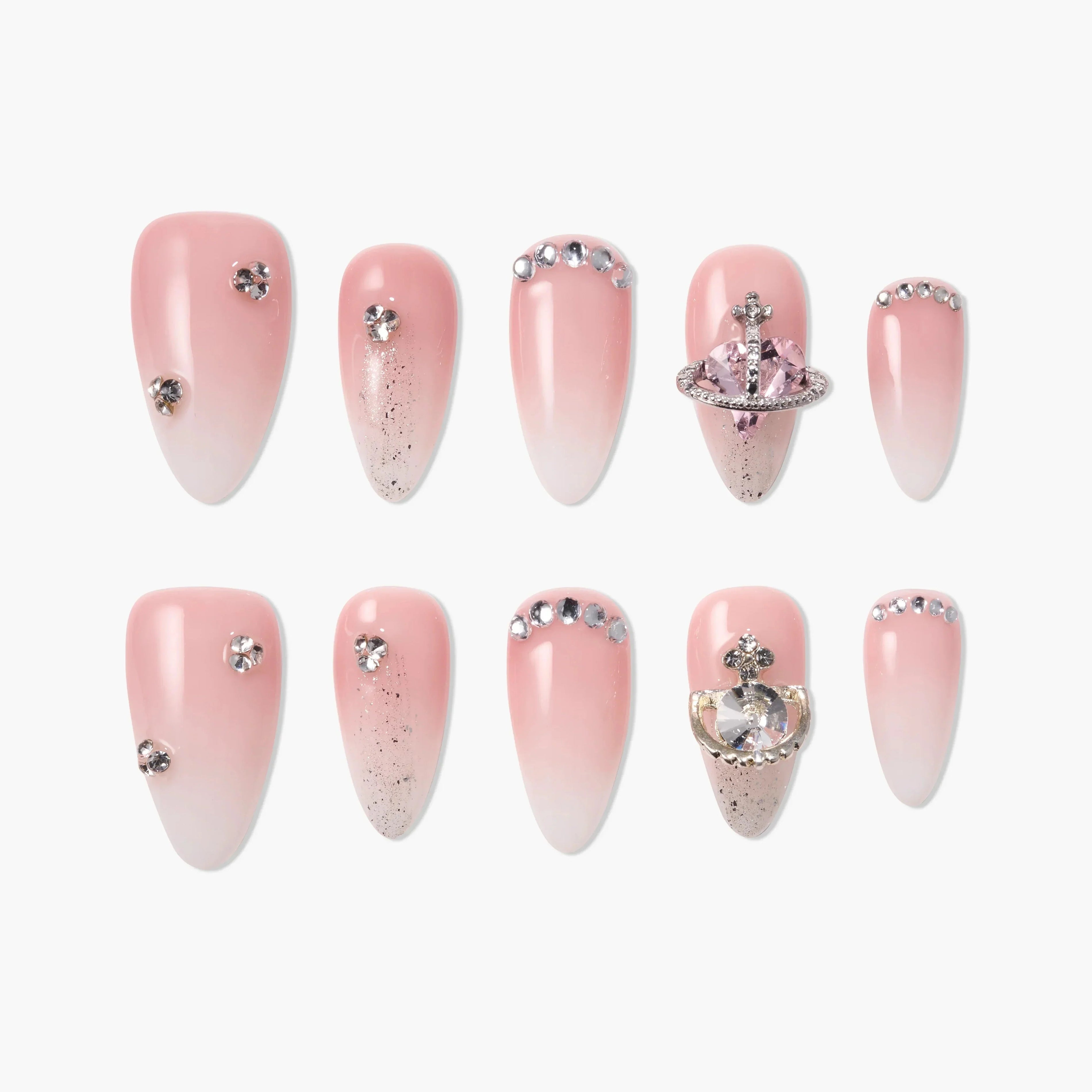 Pink ombre press-on nails with rhinestones, glitter, and 3D decorative accents
