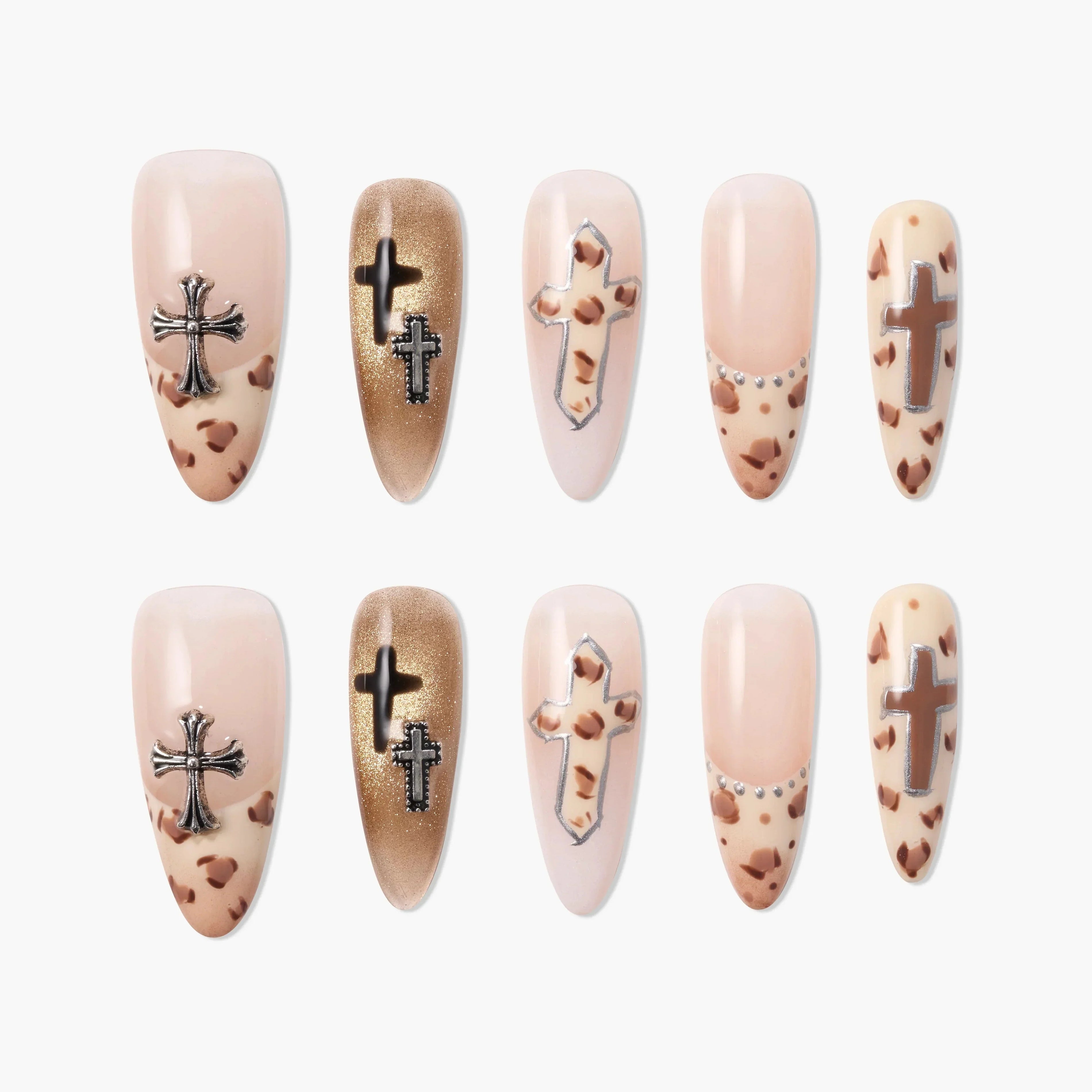 Handmade press-on nails with nude and gold tones, cross accents, and leopard print details.