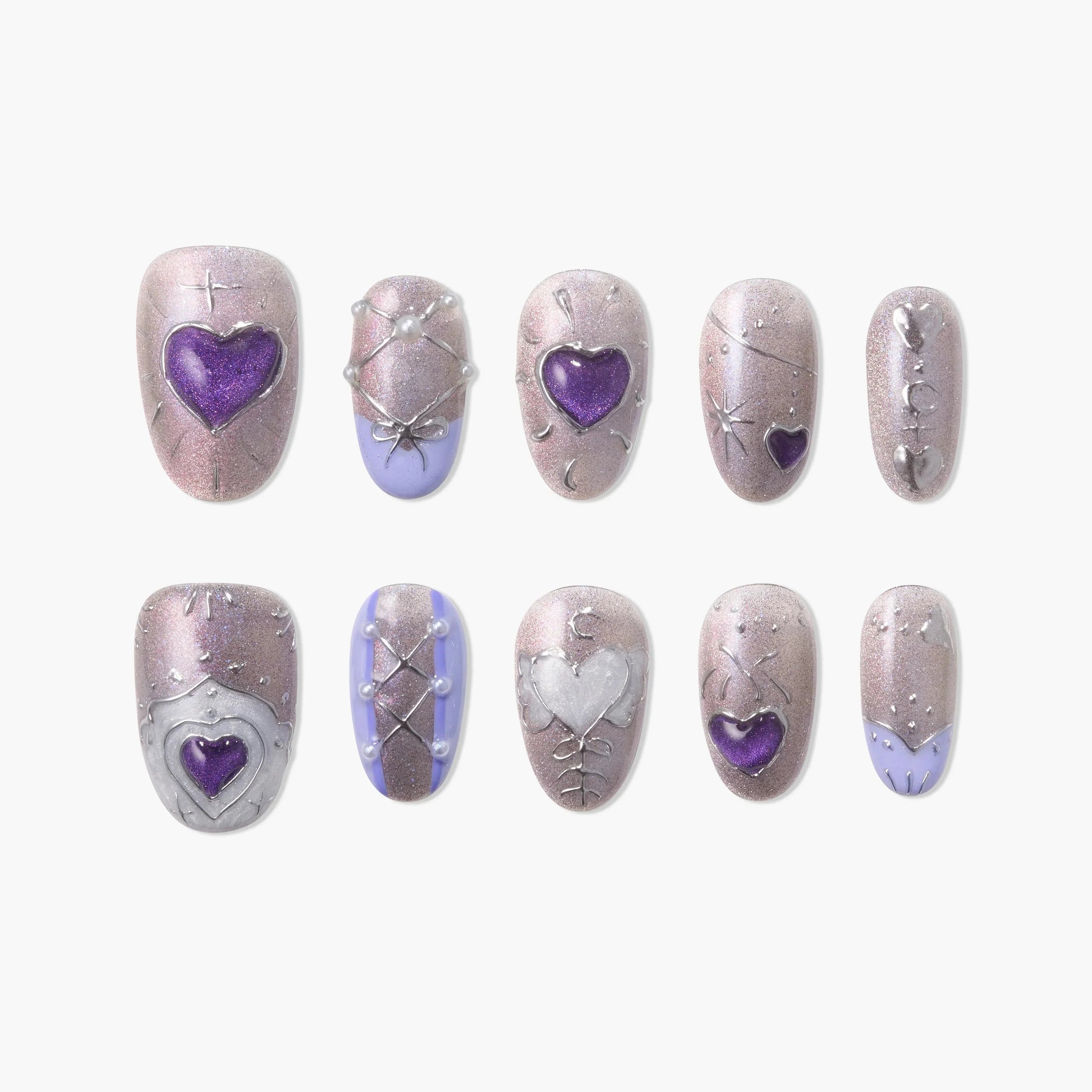 Handmade glitter press-on nails with purple and silver heart accents and lace-up designs