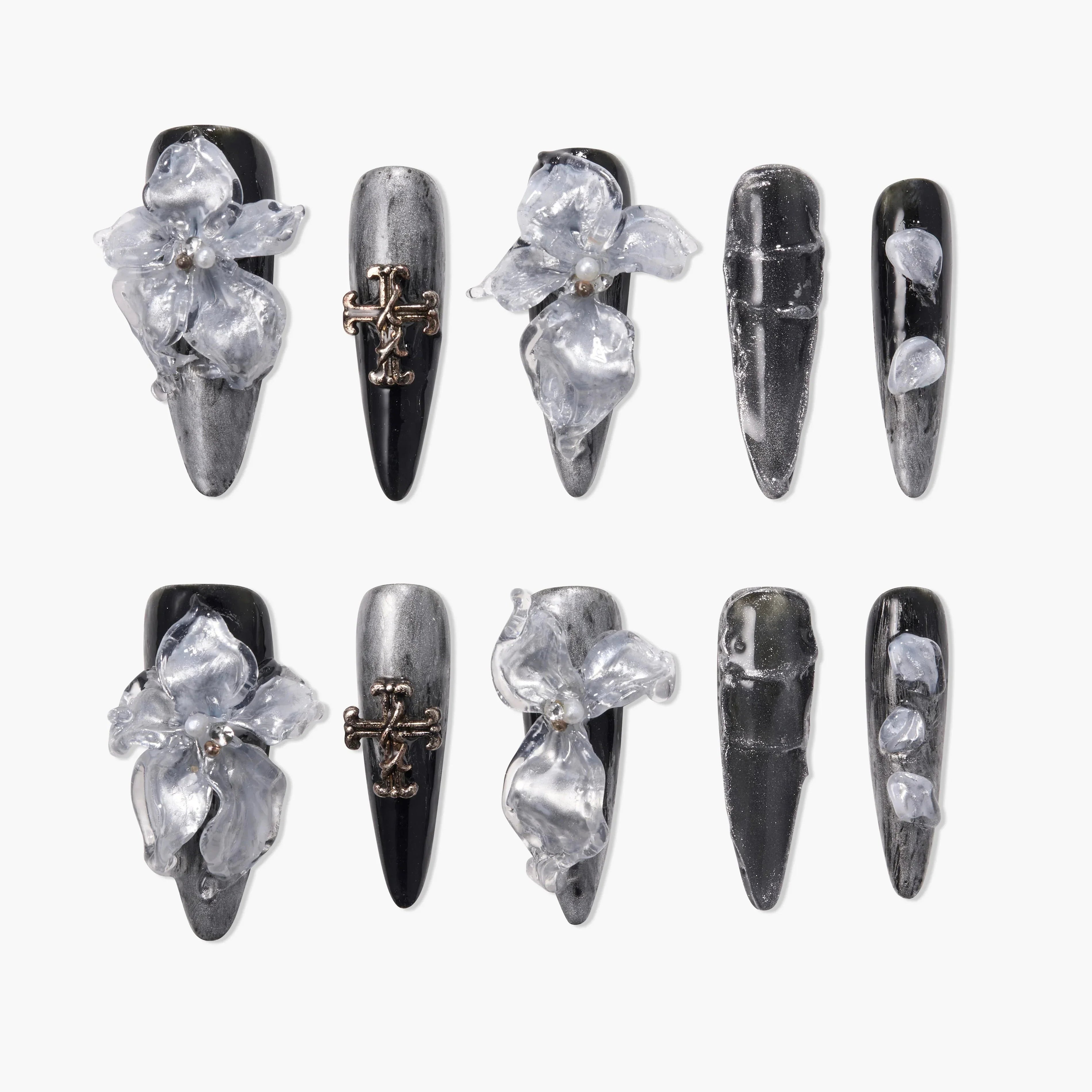 Black and silver press-on nails with 3D clear floral accents and metallic cross charms