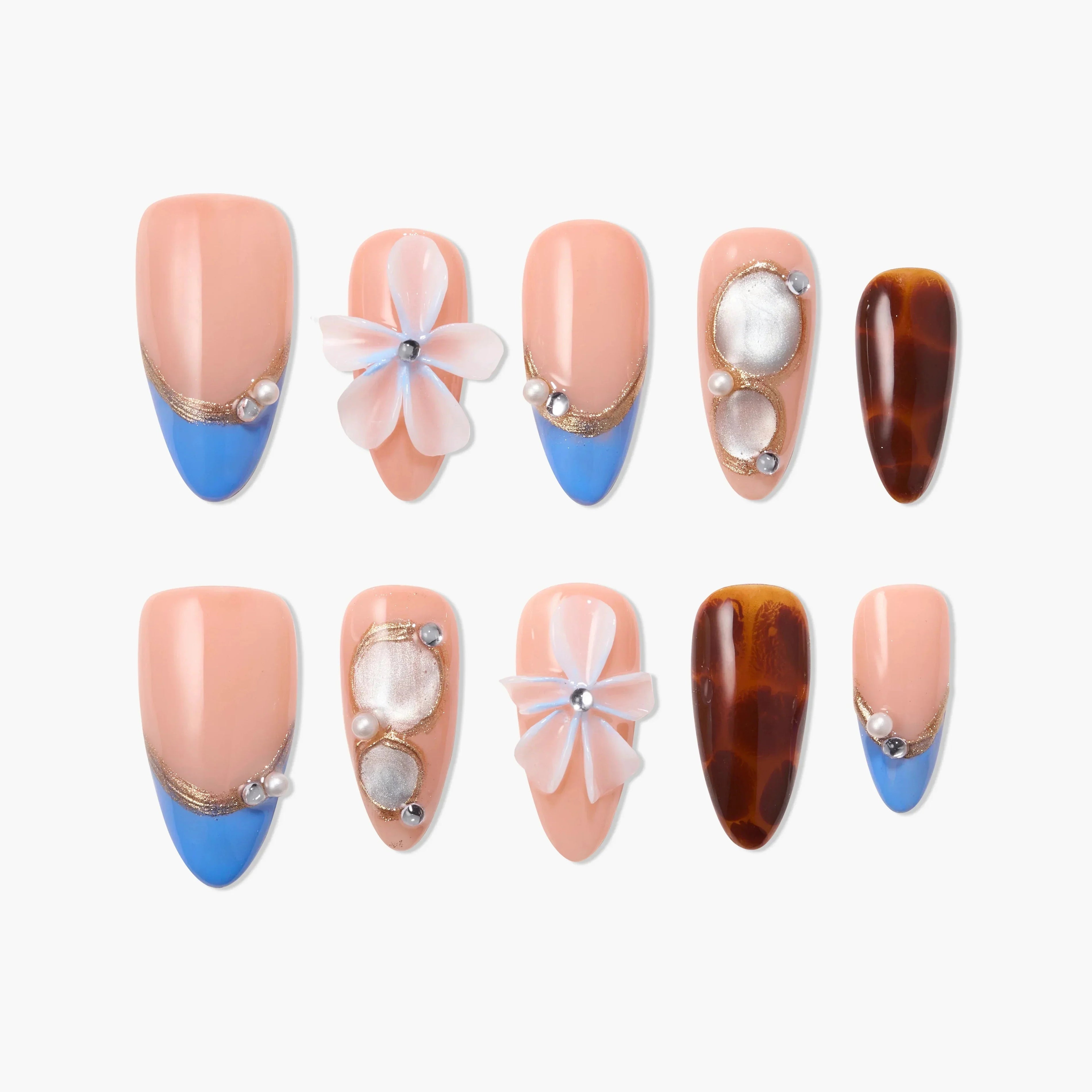 Handmade press-on nails with blue tips, pearl accents, 3D flowers, and tortoise shell patterns