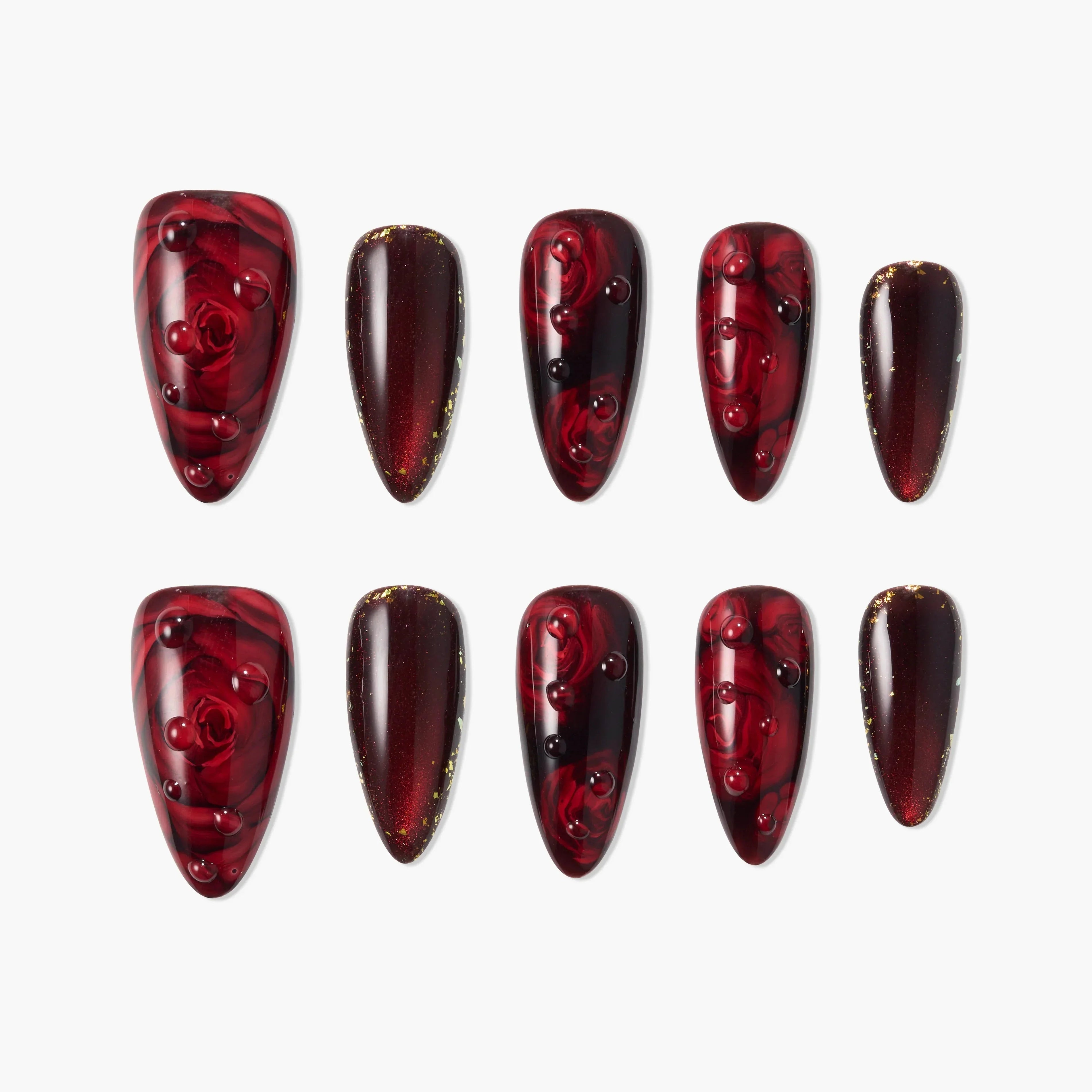 Handmade press-on nails with glossy wine red marble and rose designs, gold accents, and 3D details