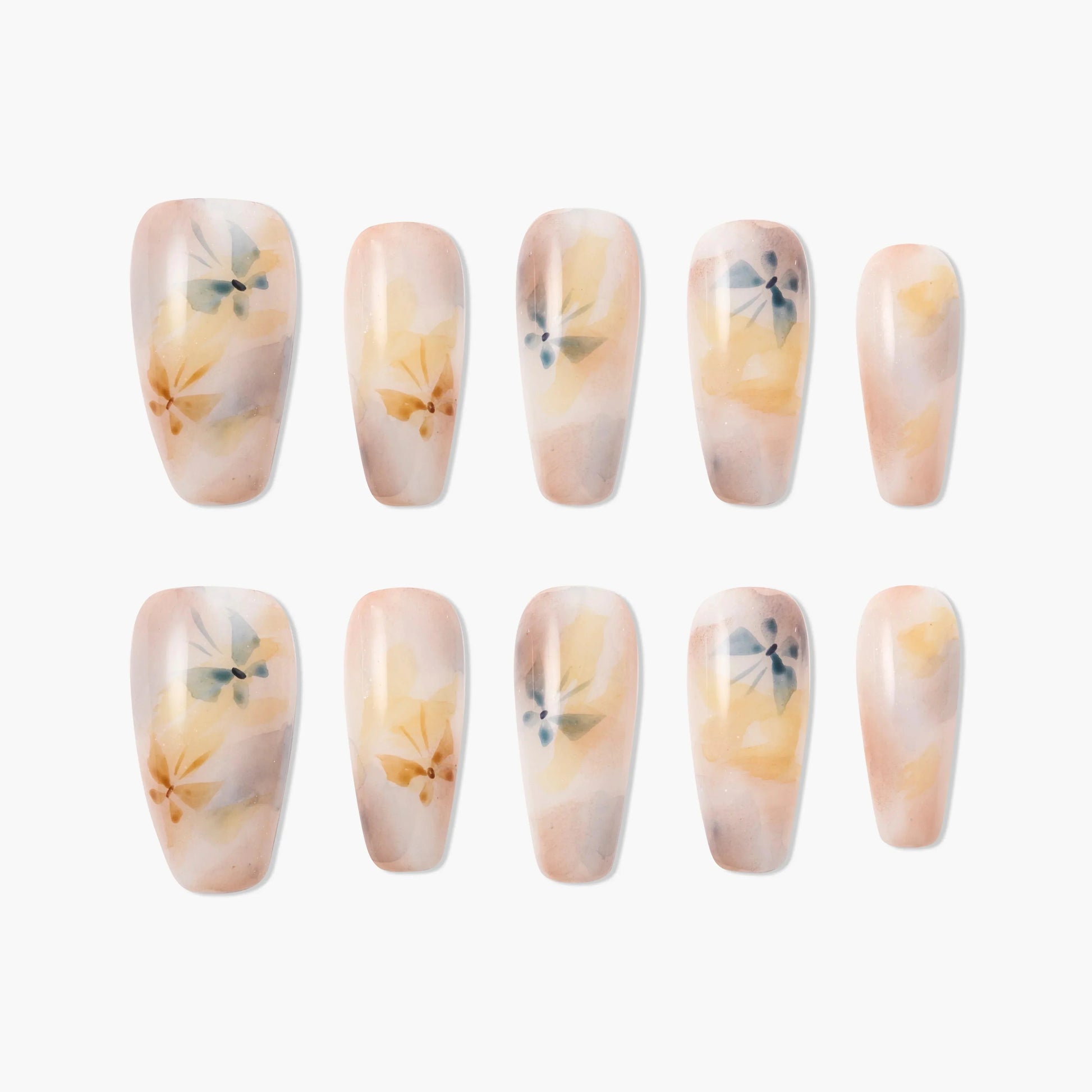 Handmade press-on nails with watercolor floral design in soft peach and yellow tones