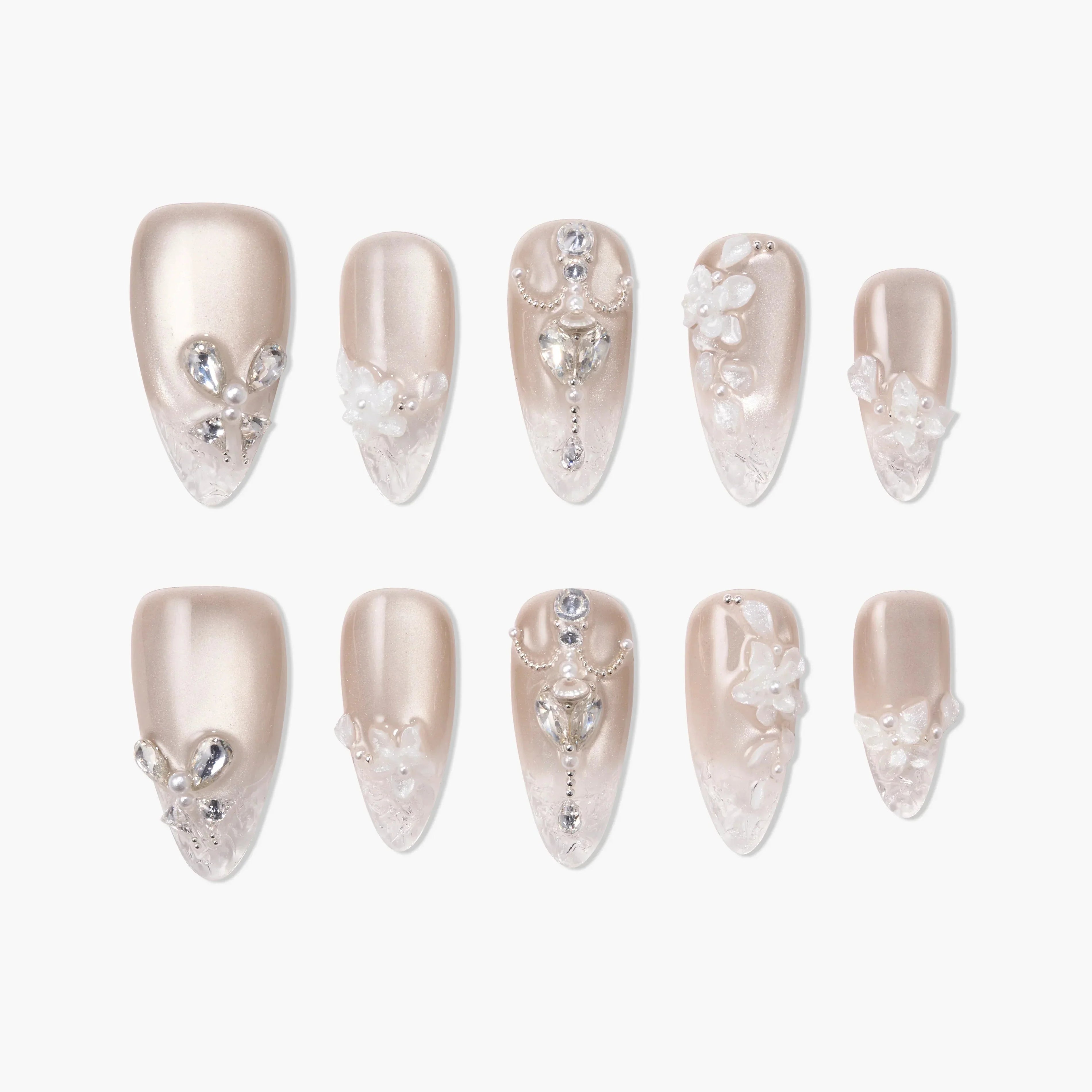 Pearl nude press-on nails with 3D crystals, floral accents, and intricate rhinestone designs