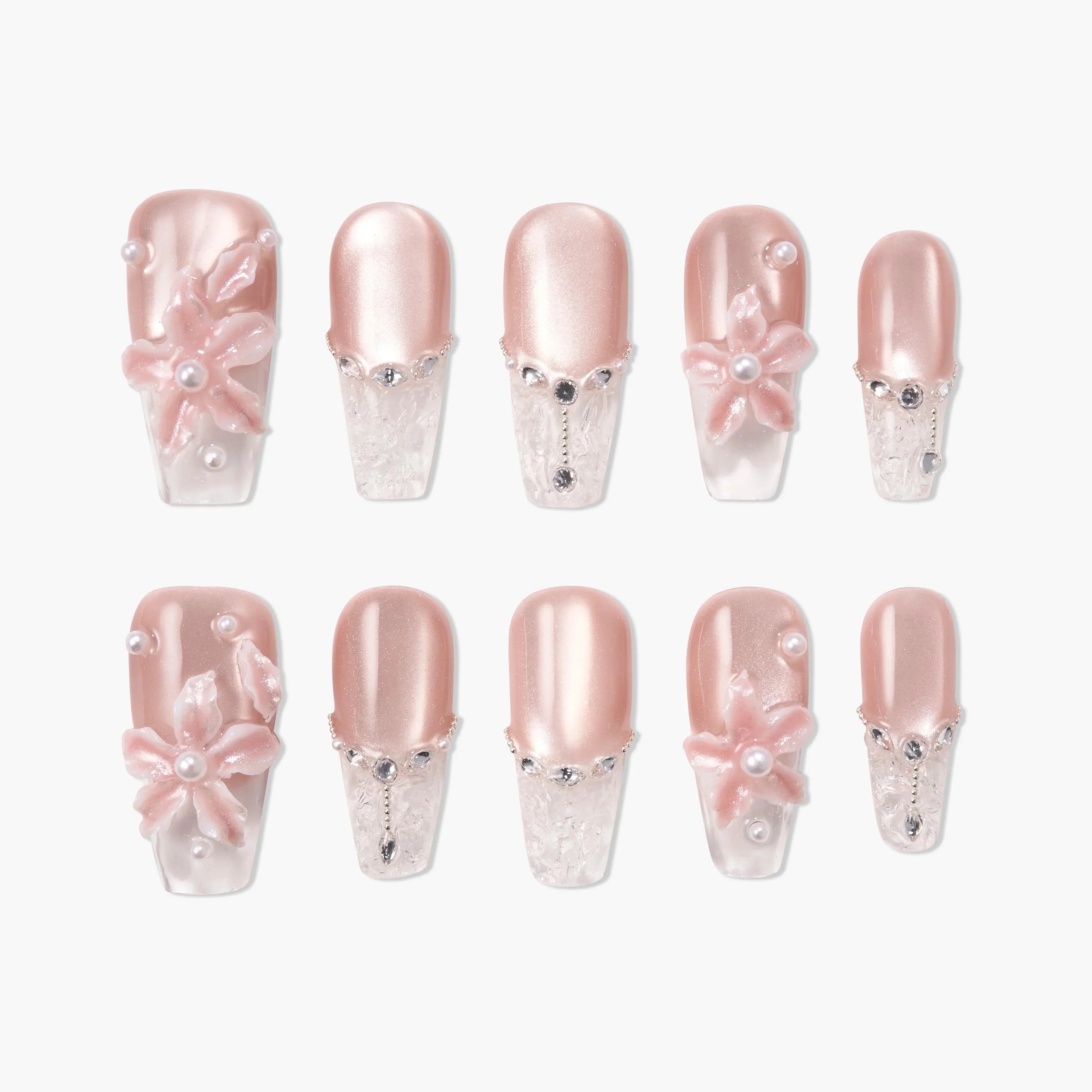 Handmade press-on nails in pink with 3D floral designs, pearls, and rhinestone accents