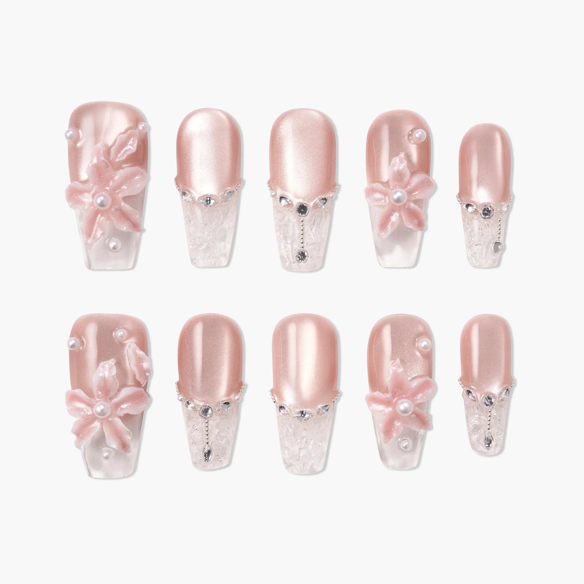 Handmade press-on nails in pink with 3D floral designs, pearls, and rhinestone accents