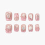 Set of pink press-on nails with pearl, seashell, starfish, and rhinestone accents