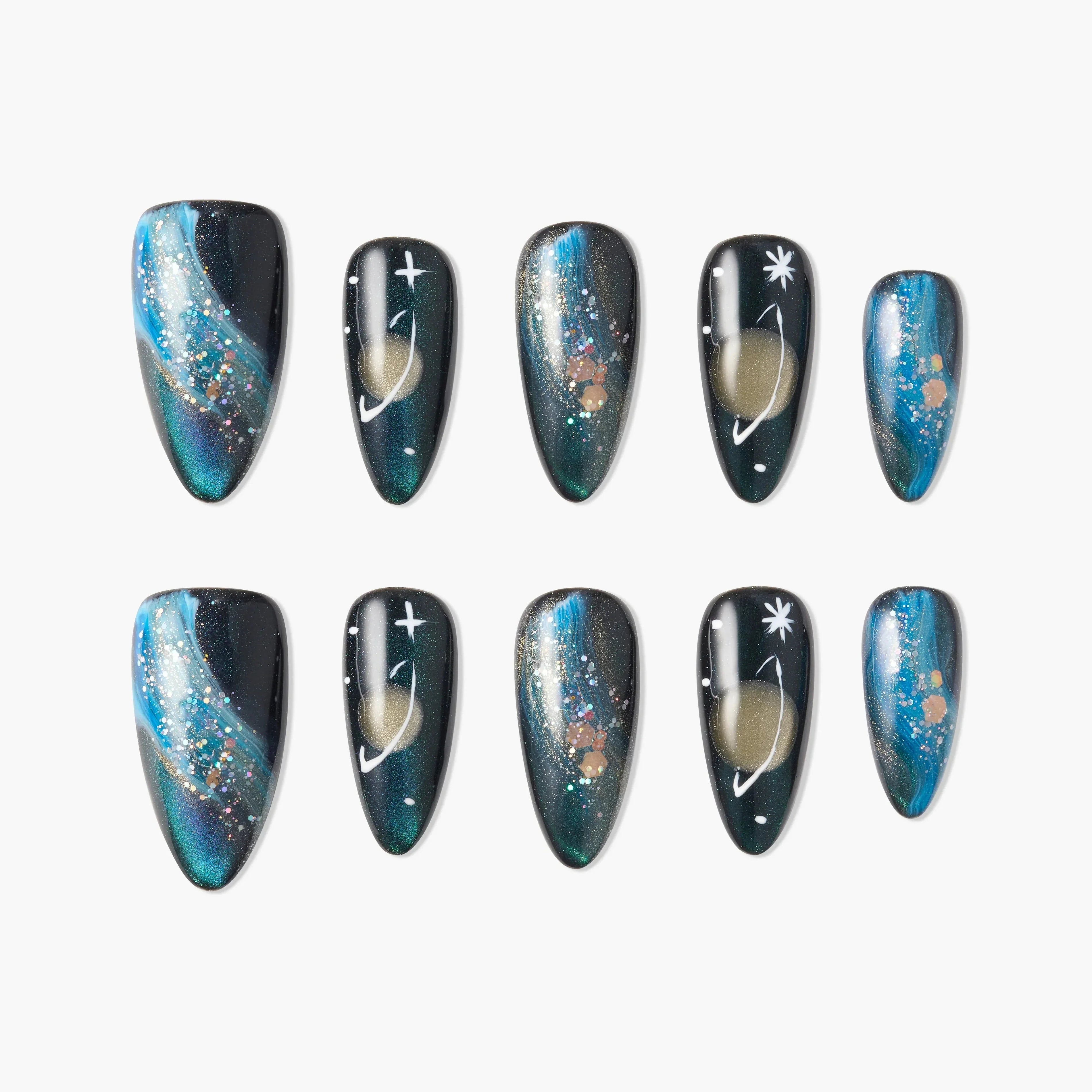 Galaxy-themed press-on nails with blue, gold, and glitter accents, featuring star and planet designs