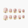 Cute animal-themed pink and beige press-on nails with paw and face designs, arranged on white background.