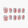 Handmade press-on nails with pink, blue, and silver glitter, featuring bow and polka dot designs