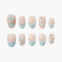 Cute blue and pink handmade press-on nails with bear, bows, gems, and plaid details