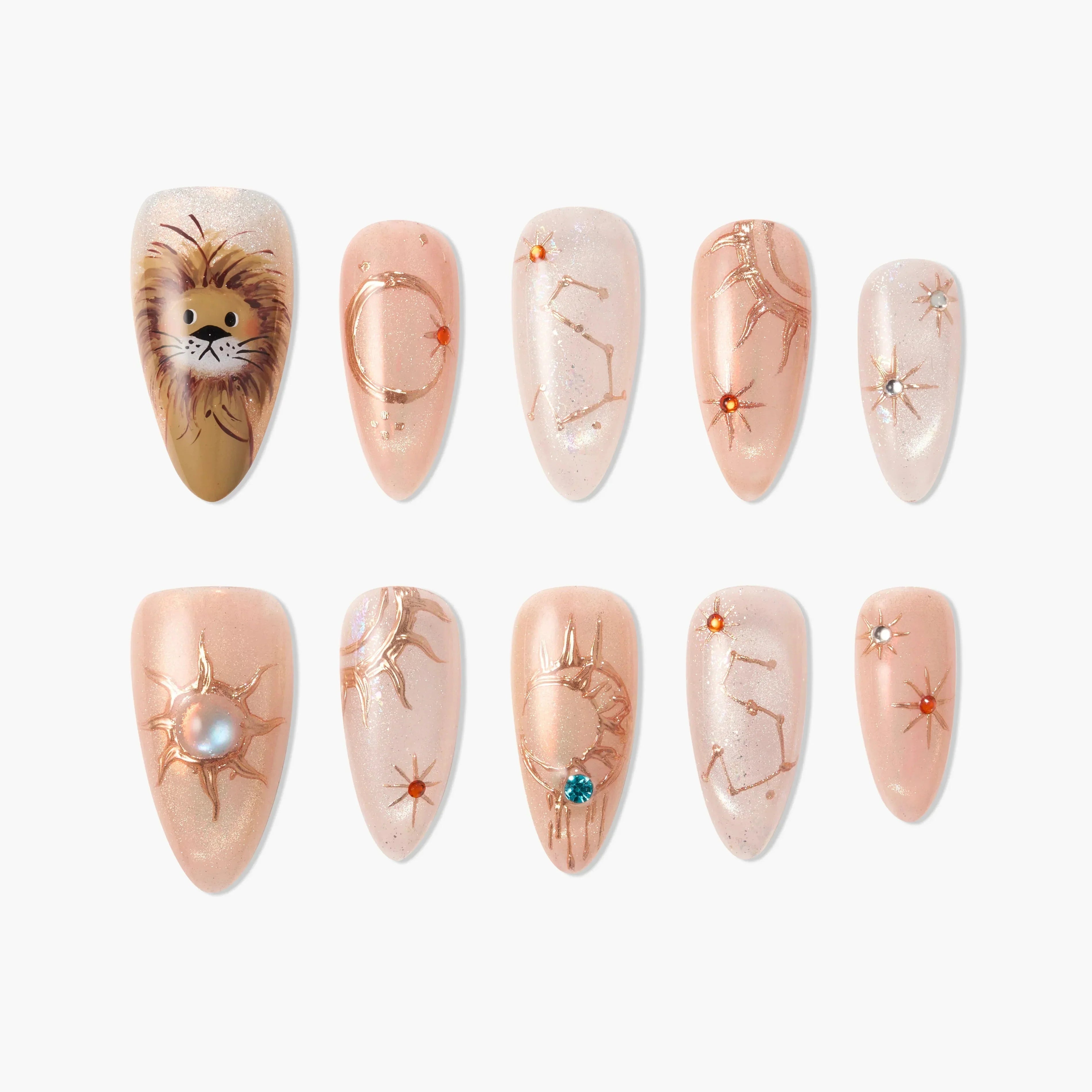 Handmade press-on nails with lion art, zodiac constellations, and gemstone accents on nude base