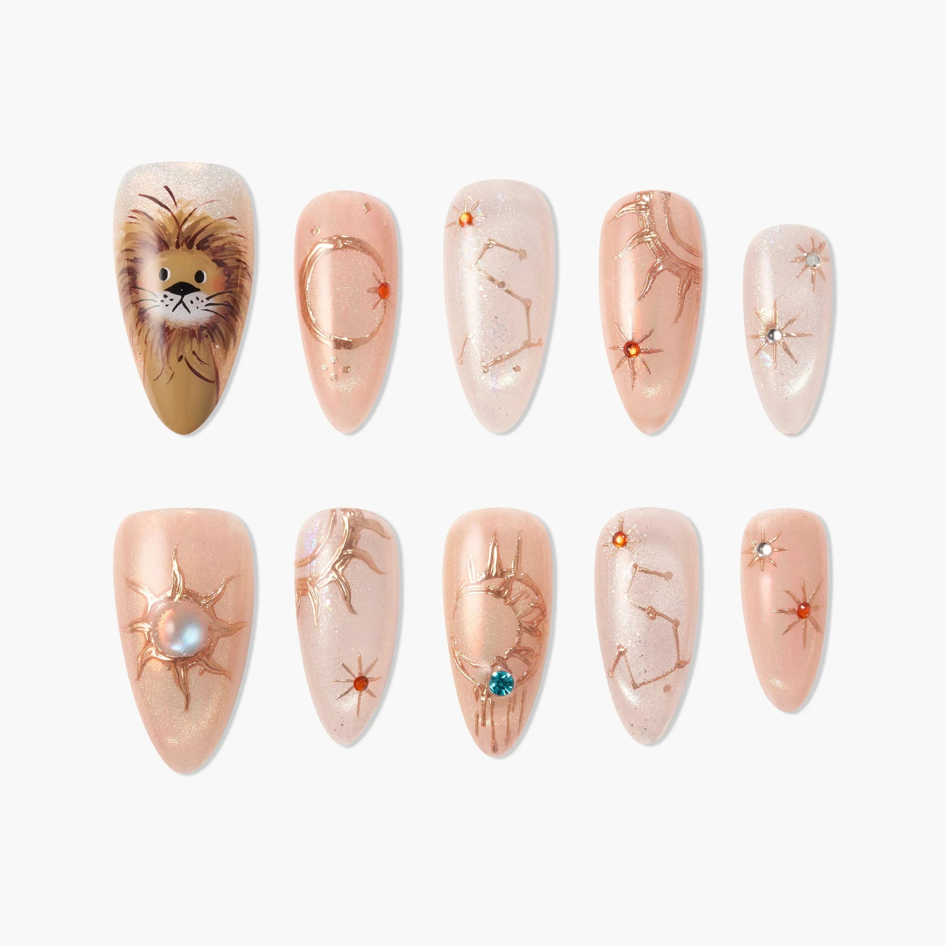 Handmade press-on nails with lion art, zodiac constellations, and gemstone accents on nude base