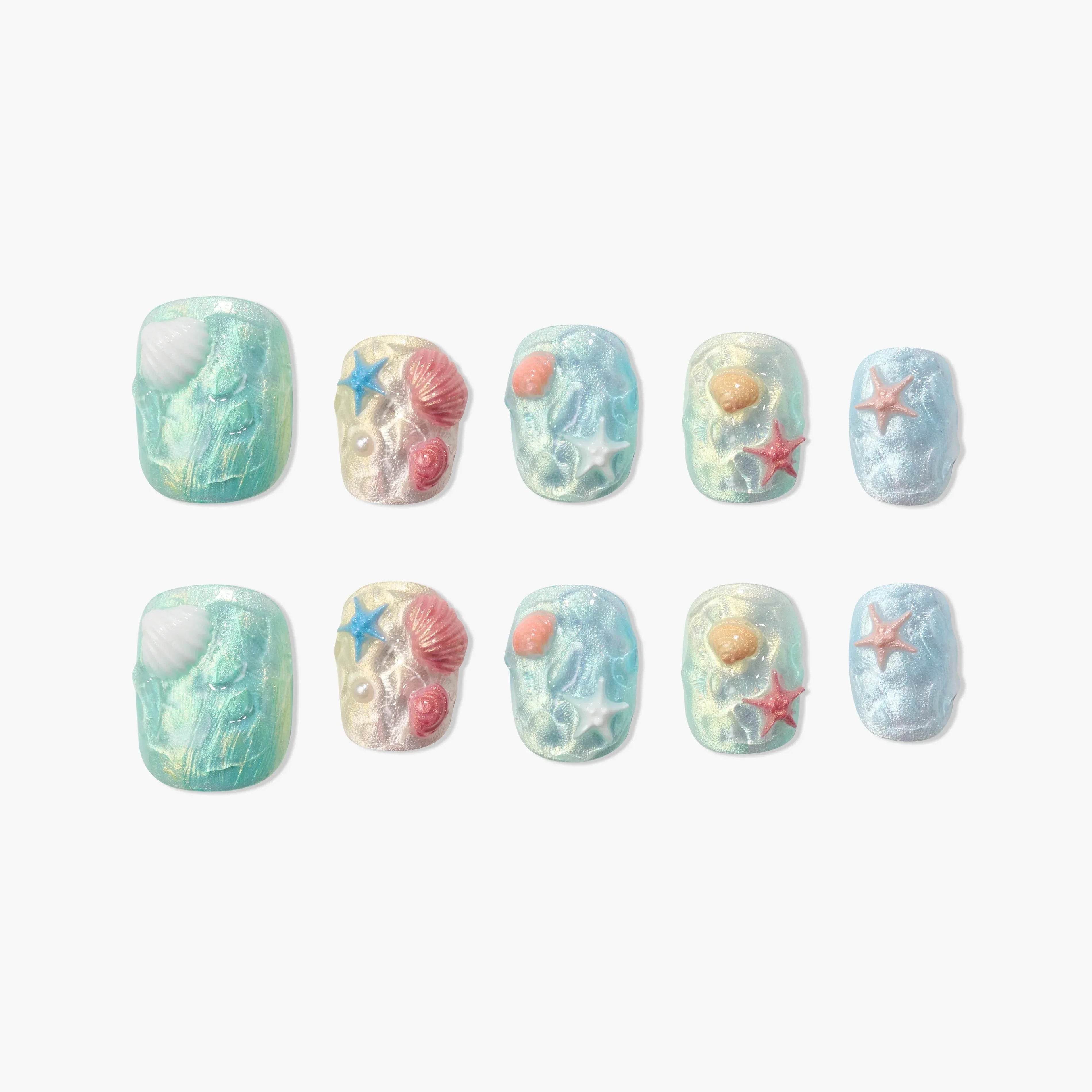 Handmade ocean-themed press-on nails with 3D seashell and starfish designs in pastel colors